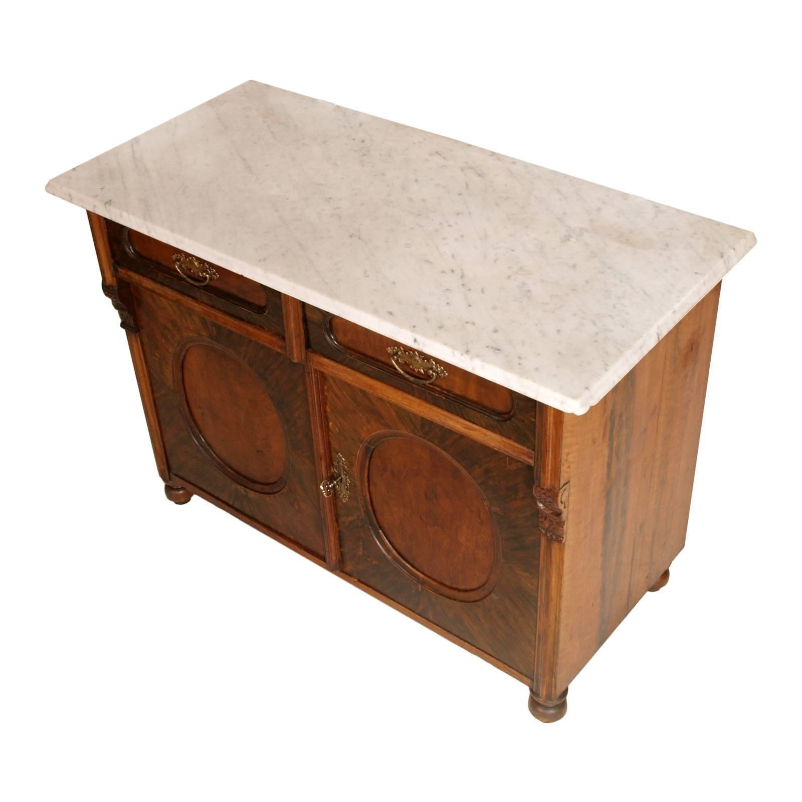 
Mid 19th Century Italian Biedermeier cabinet sideboard in solid wood walnut folder , white Carrara marble top , restored and wax finished

Measure cm: H 80   W 110   D 53

This Biedermeier Italian cabinet ,circa 1850 is in solid wood walnut folder