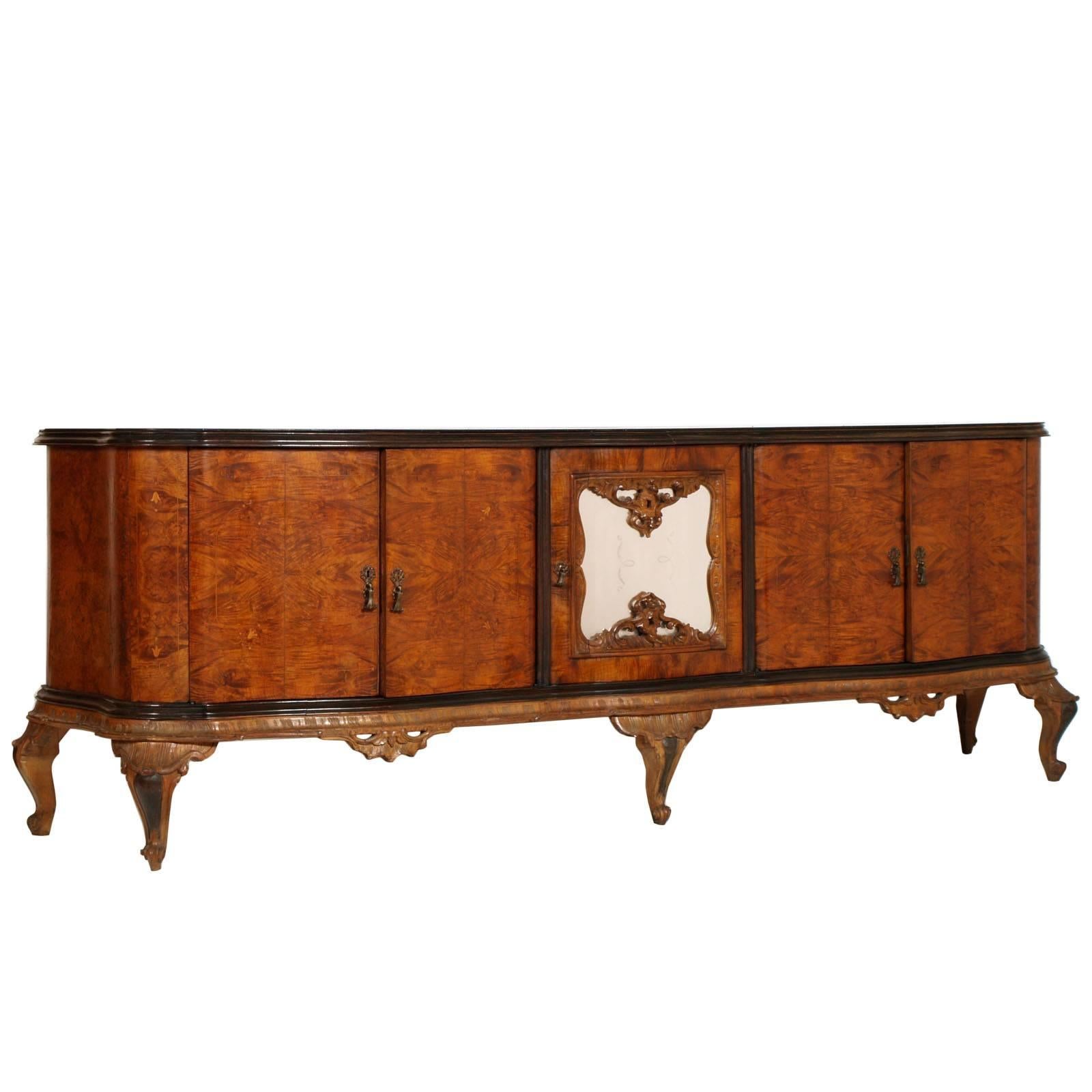 IMPORTANT: the mirror has been sold and only the sideboard remains

Early 20th century large Venetian Baroque Chippendale credenza sideboard with golden leaf mirror Fratelli Testolini attributable. Dark original glass top with elegant golden
