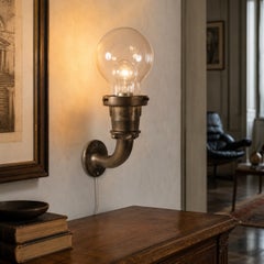 Sculptural Heavy Bronze Wall Light with Oversized Clear Glass Globe, circa 1970