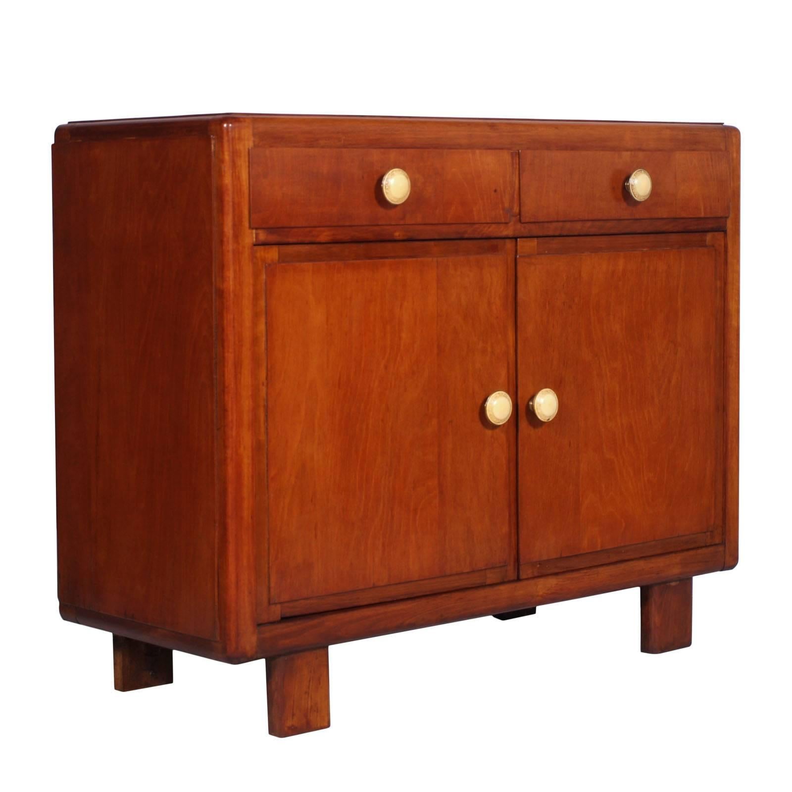 A robust Art Deco sideboard in blond and ebonized walnut. Restored, finished with wax with all the original accessories
The bottom of the drawers and the sideboard is in solid pine

Measure cm H 100 x W 120 x D 50”.
