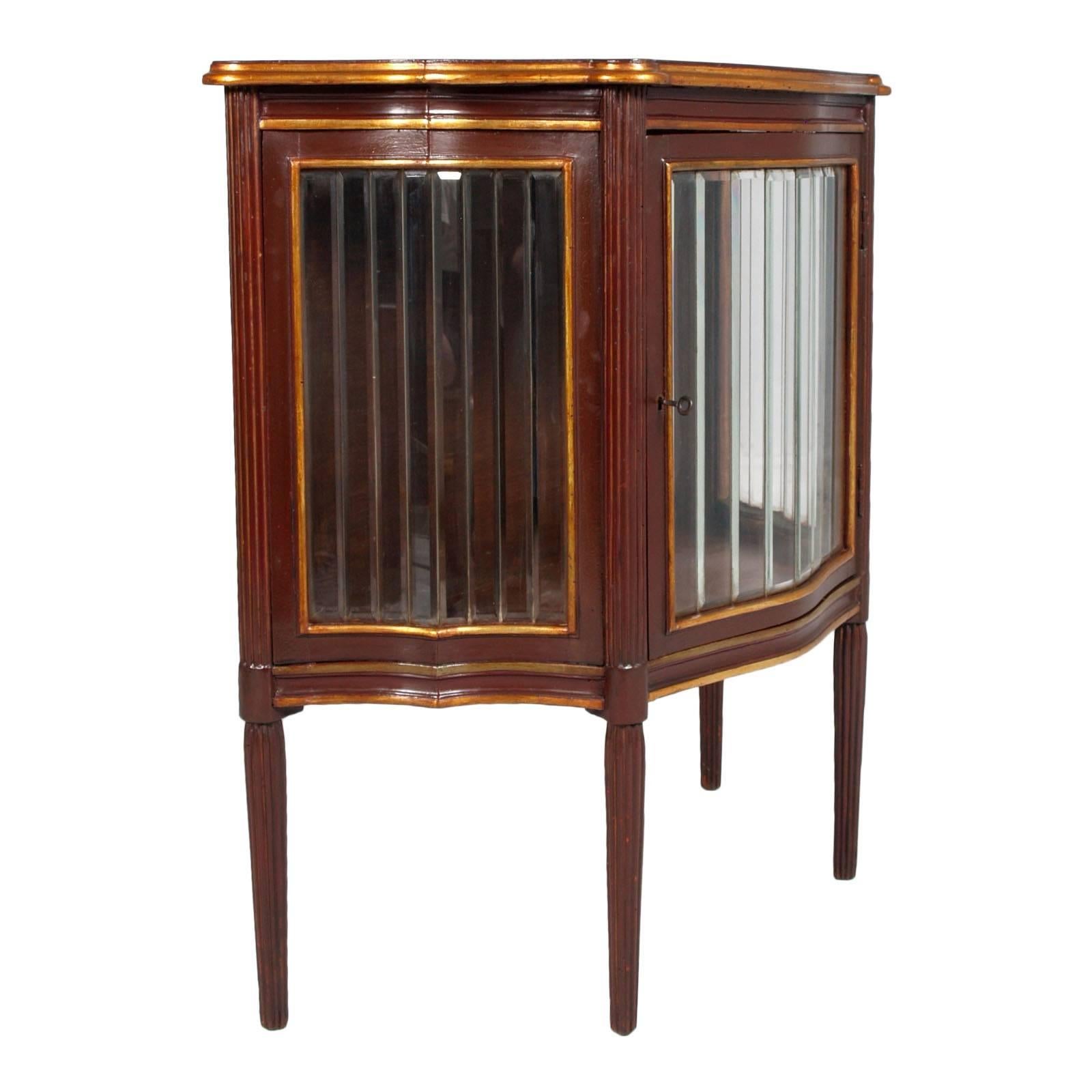 Art Nouveau vitrine cupboard in lacquered and gilded mahogany with all accosted glazed glass. 
Legs a hand-carved, lacquered mahogany columns; edgings in gold leaf gilded relief

Measures cm: D 40, W 93, H 91.