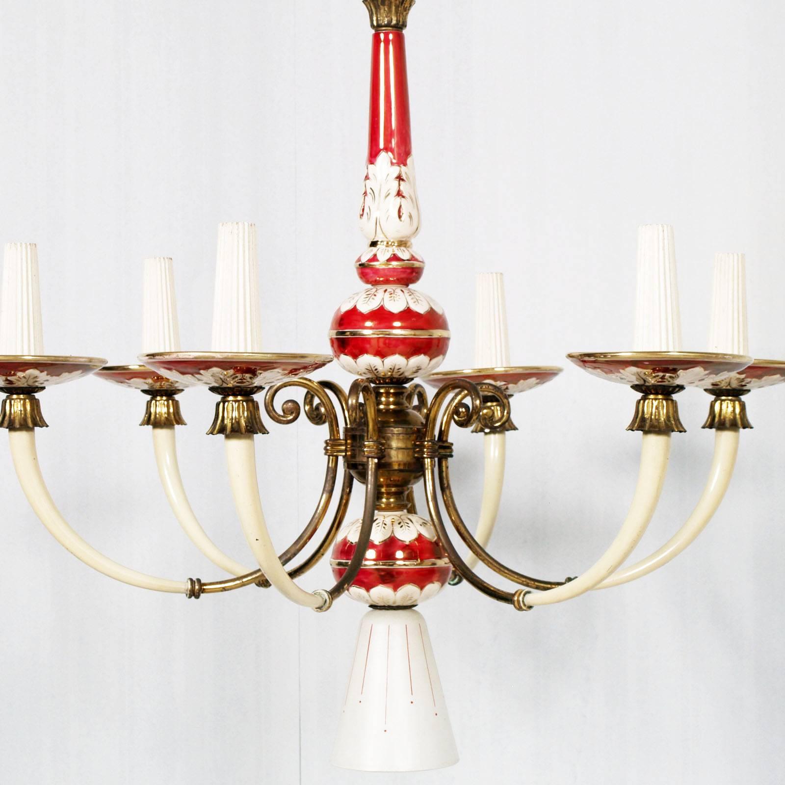 Elegant Art Deco six-light Florence chandelier, in gold decorated porcelain and enameled brass
Renewed and functioning electrical system

Measures cm: H 110 x D 65.