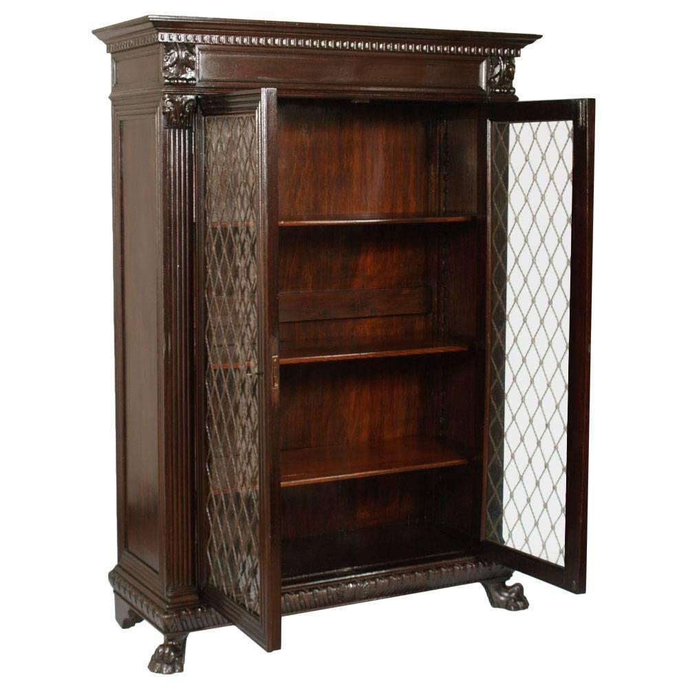 Important Italian Tuscany Renaissance Bookcase, by Michele Bonciani - Cascina - Tuscany, widely hand-carved with renaissance motifs , in ebonized walnut polished to wax. Original glass of the period; iron railings twisted and worked in rhombus fixed