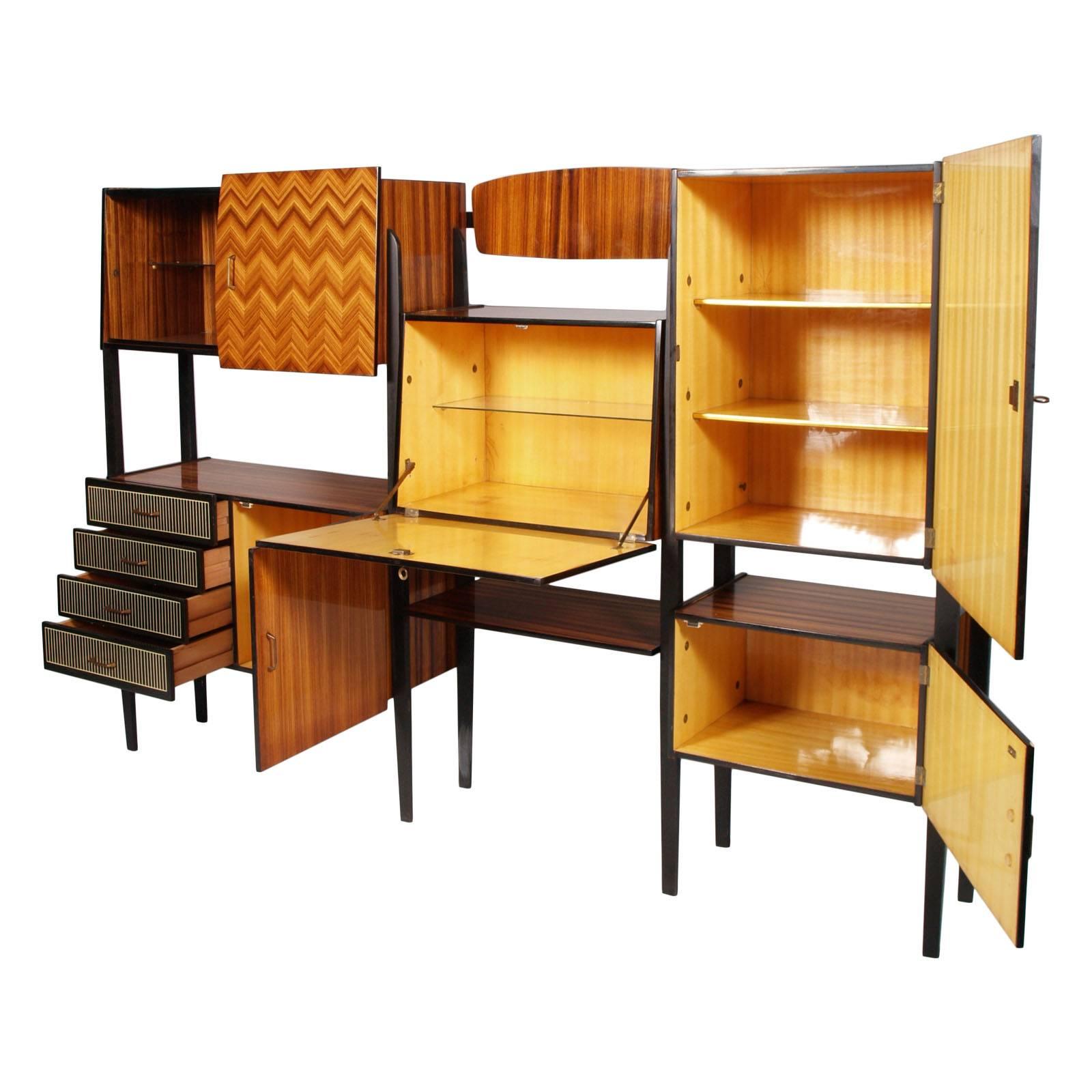 1950s Cantu bookshelf, sideboard, Osvaldo Borsani style, with ebonized walnut structure. External veneer in lacquered rosewood; interior in lacquered maple wood ; Lacquered external surfaces worked in a herringbone pattern with various wood essences