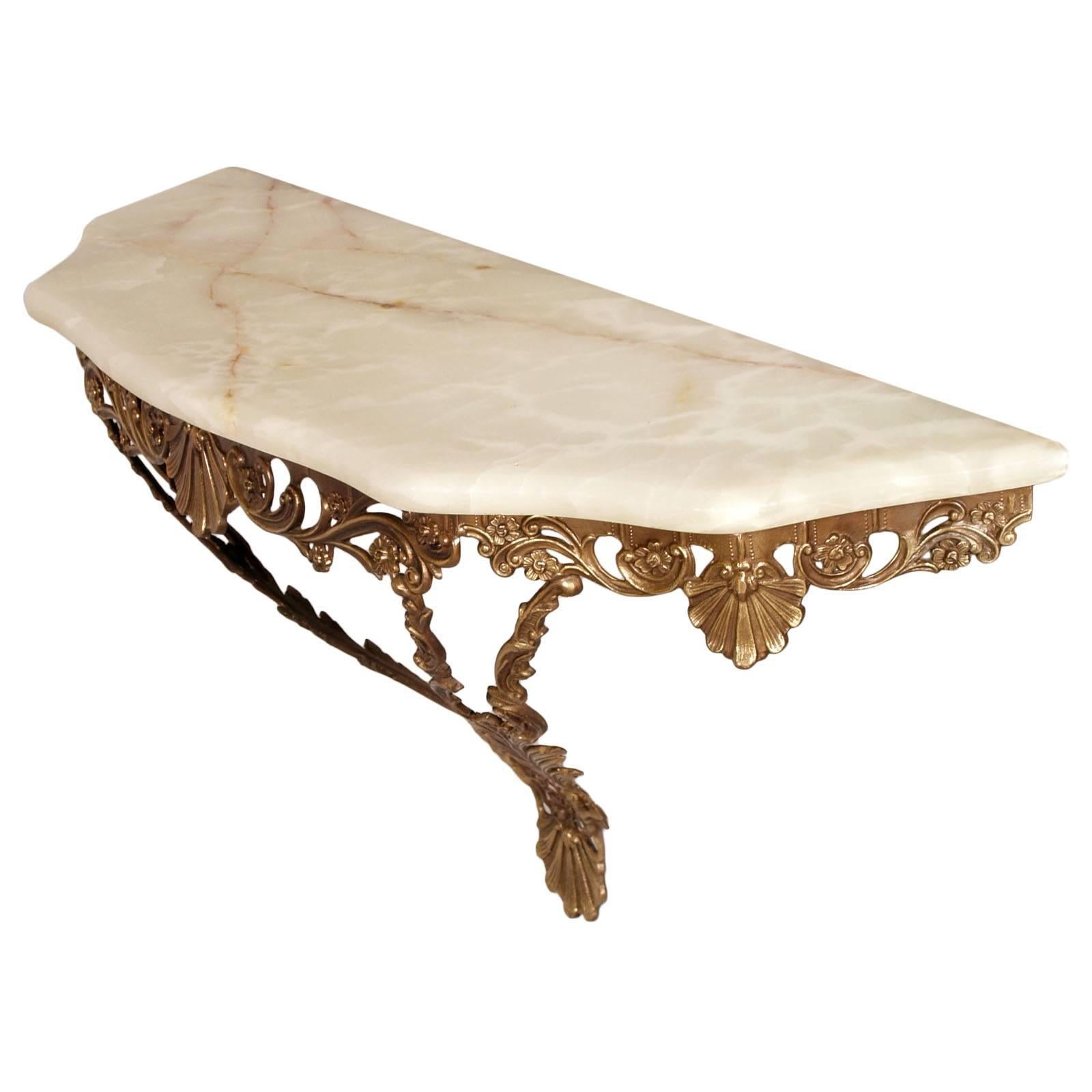 Elegant heavy burnished and gilt bronze, Venetian Baroque console, with white onyx marble top, Vincenzo Cadorin attributable
Measures cm: H 45 x W 87 x D 28.