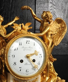 Orologio antico francese in bronzo dorato e marmo “Amore e Psiche” di Bagues Frères, Parigi