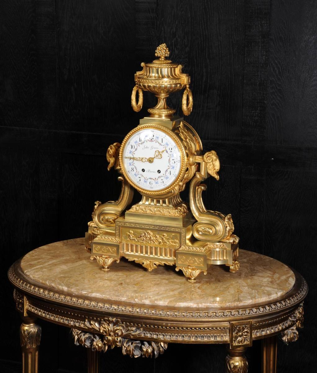 A very large and palatial Louis XVI style ormolu clock by the bronzier Jules Graux. It is of impressive size, beautifully modelled in the classical style of Louis XVI, exquisitely chased laurel leaves, scrolls, ram's head and an urn to the top. This
