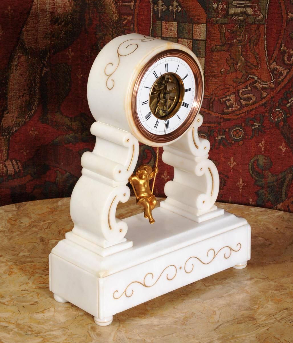 A super, fully working and tested, rare original antique French clock featuring a cherub swinging back and forth as the pendulum. It is particularly rare, being the larger version with a marble case rather than the more often seen alabaster cased