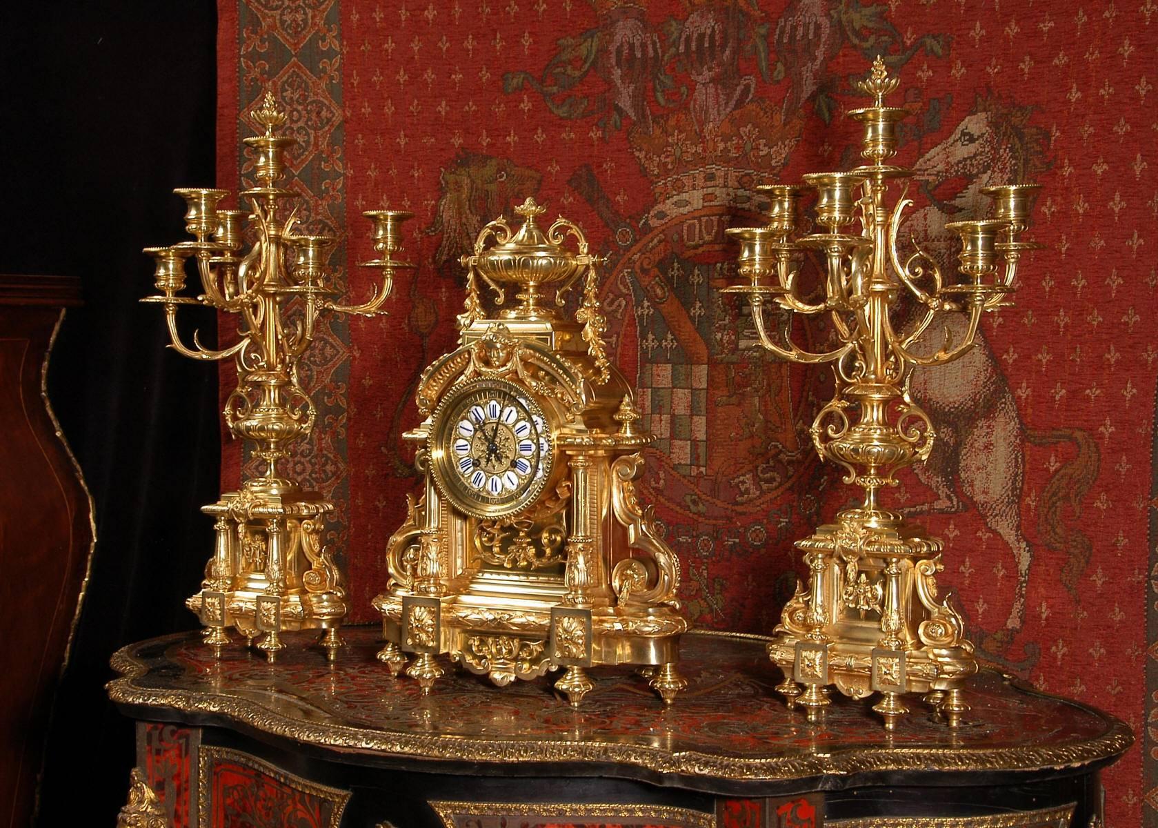 A stunning, superb quality, large and heavy clock set by the famous maker Japy Freres. It is very finely modelled in bronze in the Louis XVI classical style. Two columns sit either side of a blind fretted panel of ornate acanthus scrolls with scroll