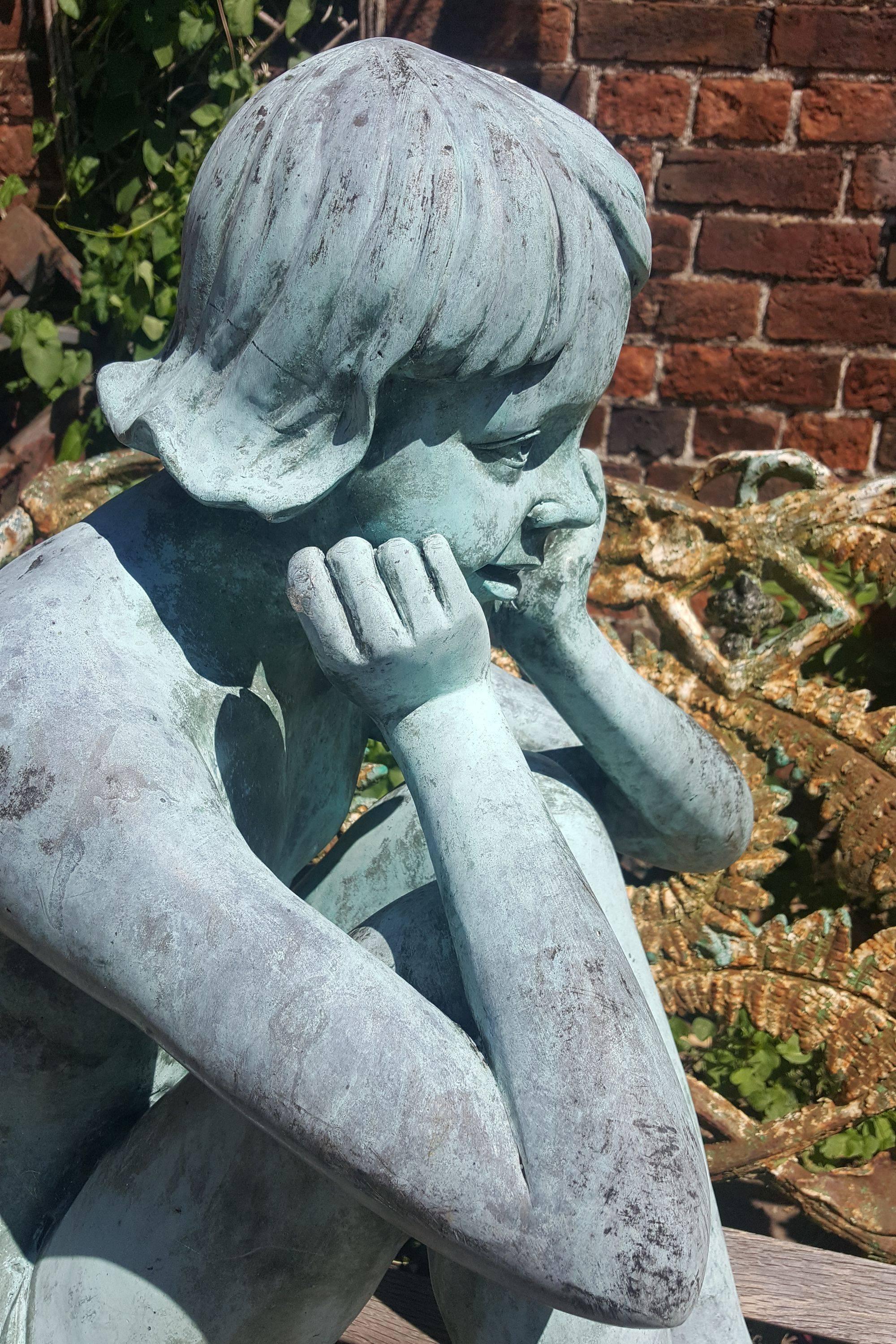 A lovely vintage hollow bronze sculpture of a seated girl, beautifully life-like and with excellent blue / green pagination with further natural weathering.

Measures: Width 22