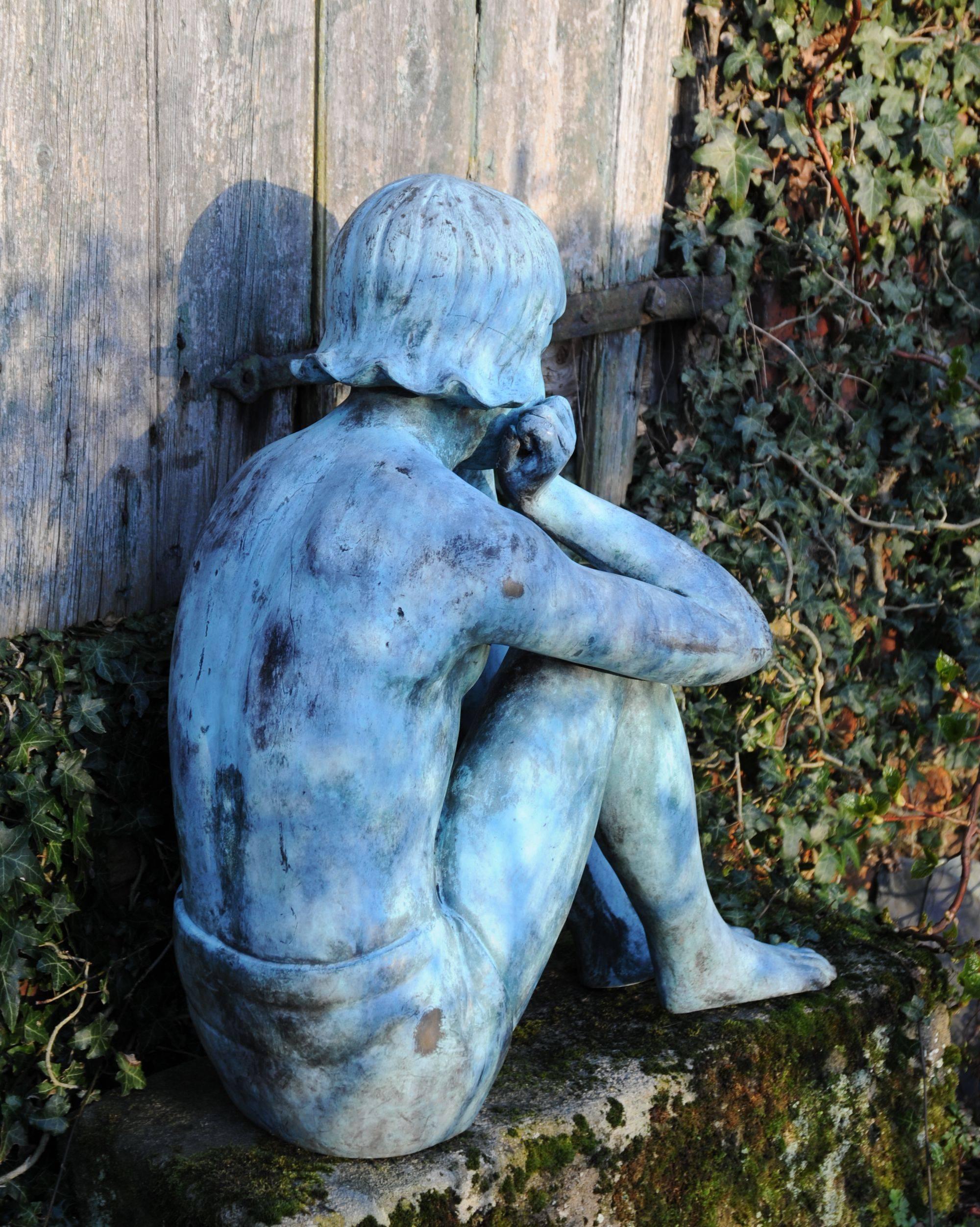 Patinated Bronze Sculpture of a Seated Girl