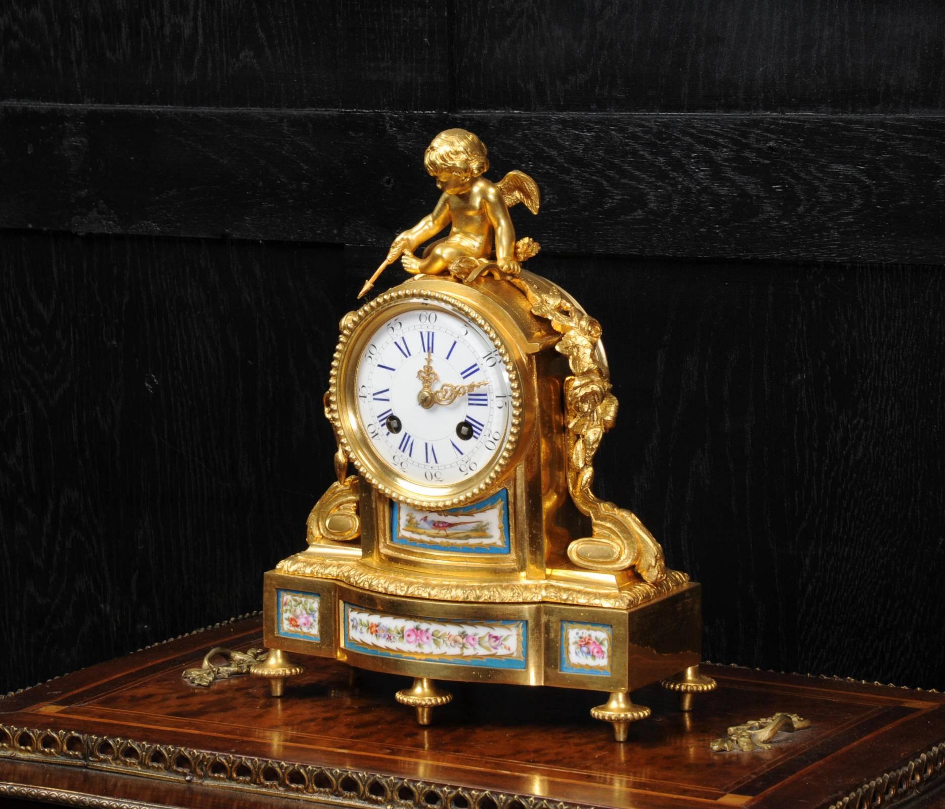 A fine and early clock by Japy Freres, fully overhauled and working. It is beautifully made in ormolu (fire gilded bronze doré) mounted with exquisite Sèvres style porcelain. The porcelain has a Bleu Celeste ground with delicately painted flowers