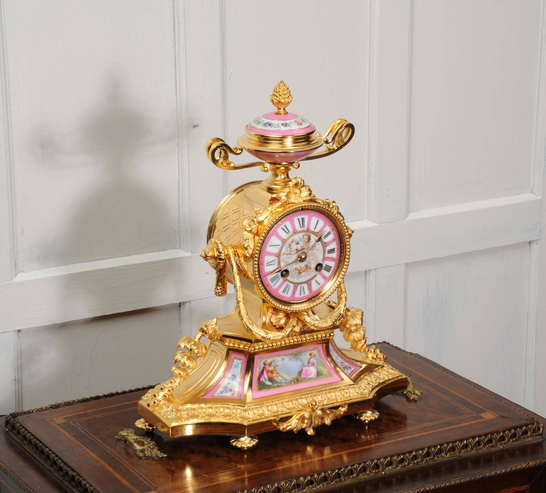 A most exquisite original antique French clock by the famous maker Japy Freres, circa 1860. It is finely modelled in ormolu (finely gilded bronze), beautifully finished and in stunning condition. It is mounted with Sevres style porcelain, each piece