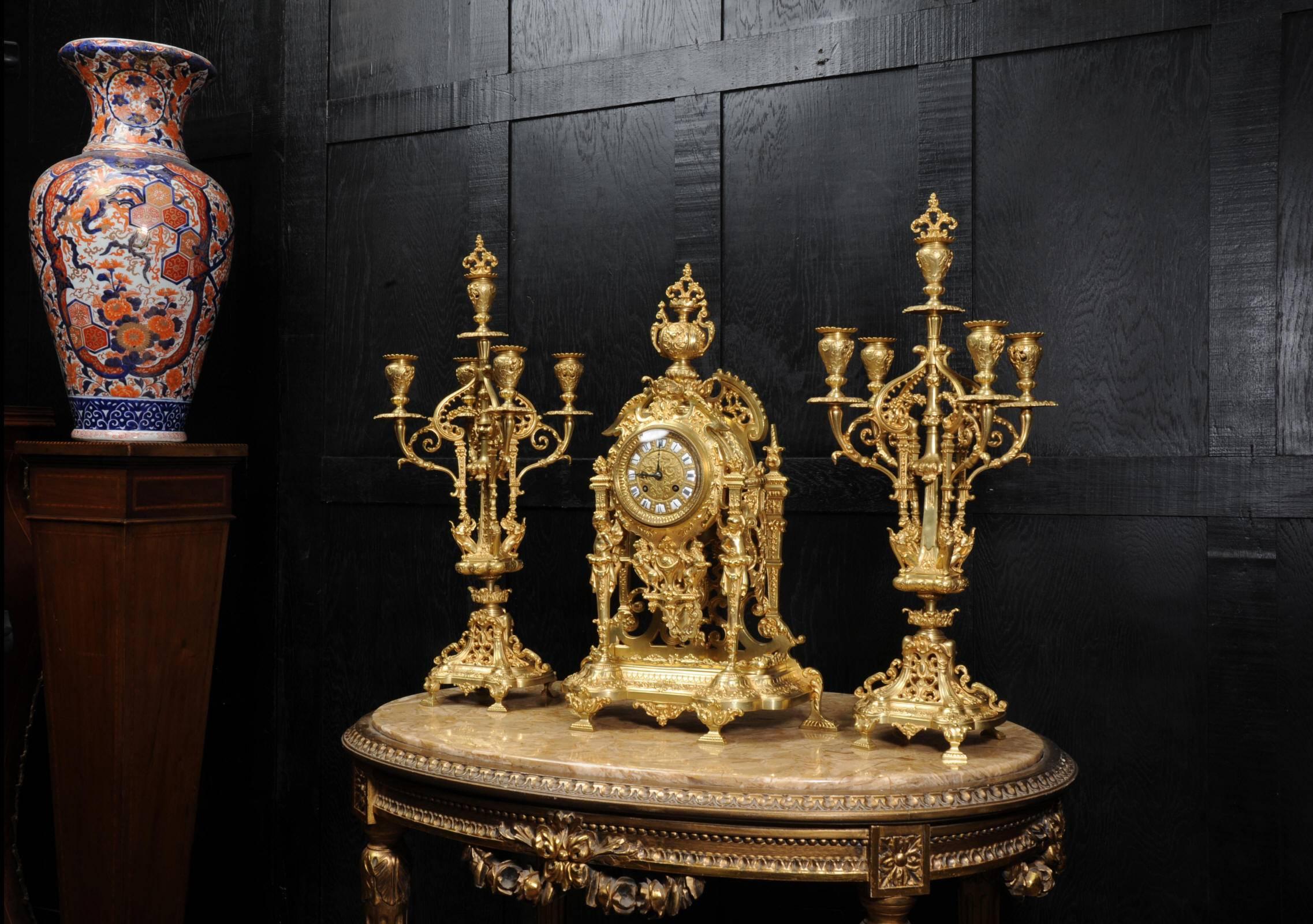 French Large and Stunning Gilt Bronze Clock Set with Visible Pendulum