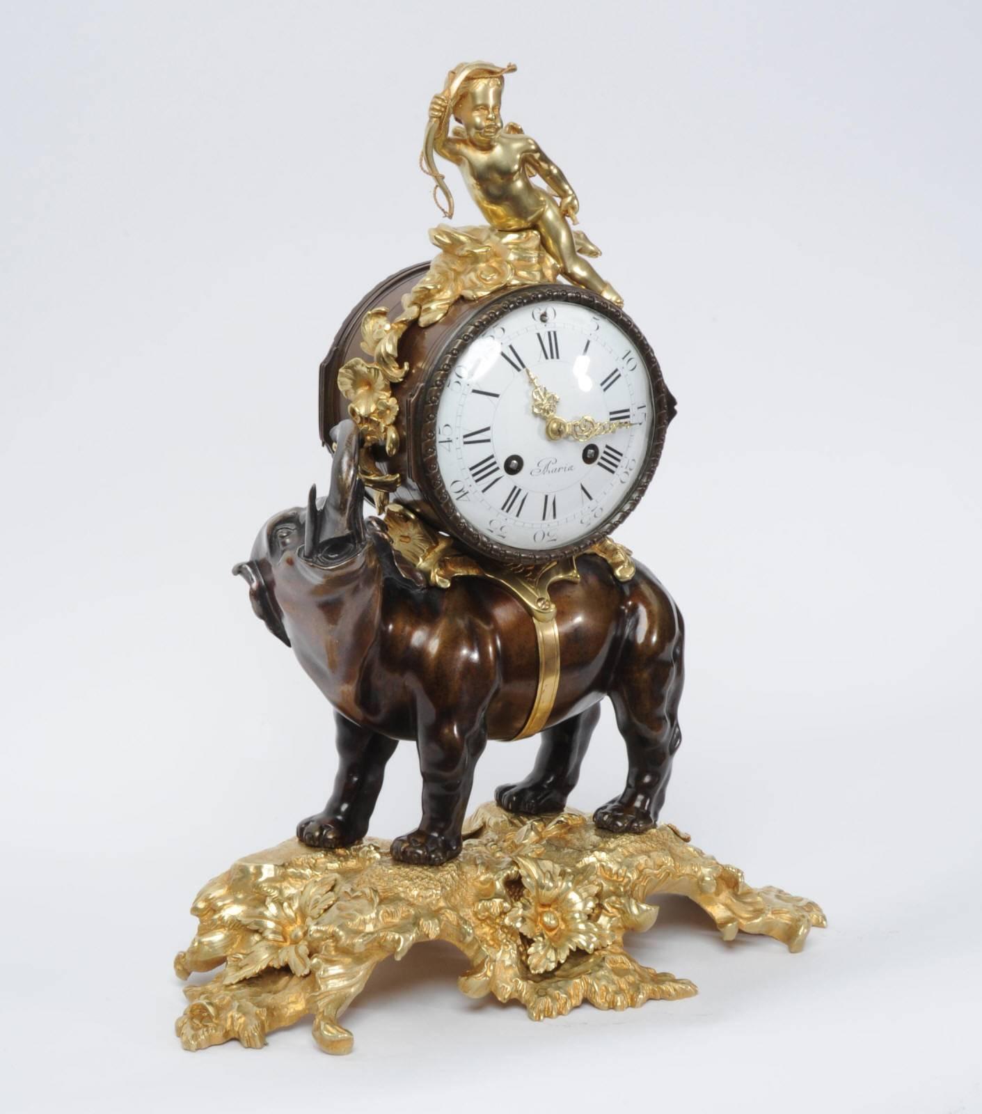 A fabulous and rare original antique French clock, featuring an elephant carrying the clock with cupid seated on top. It is beautifully made in bronze and ormolu (finely gilded bronze). The elephant stands proudly on a naturalistically modelled base