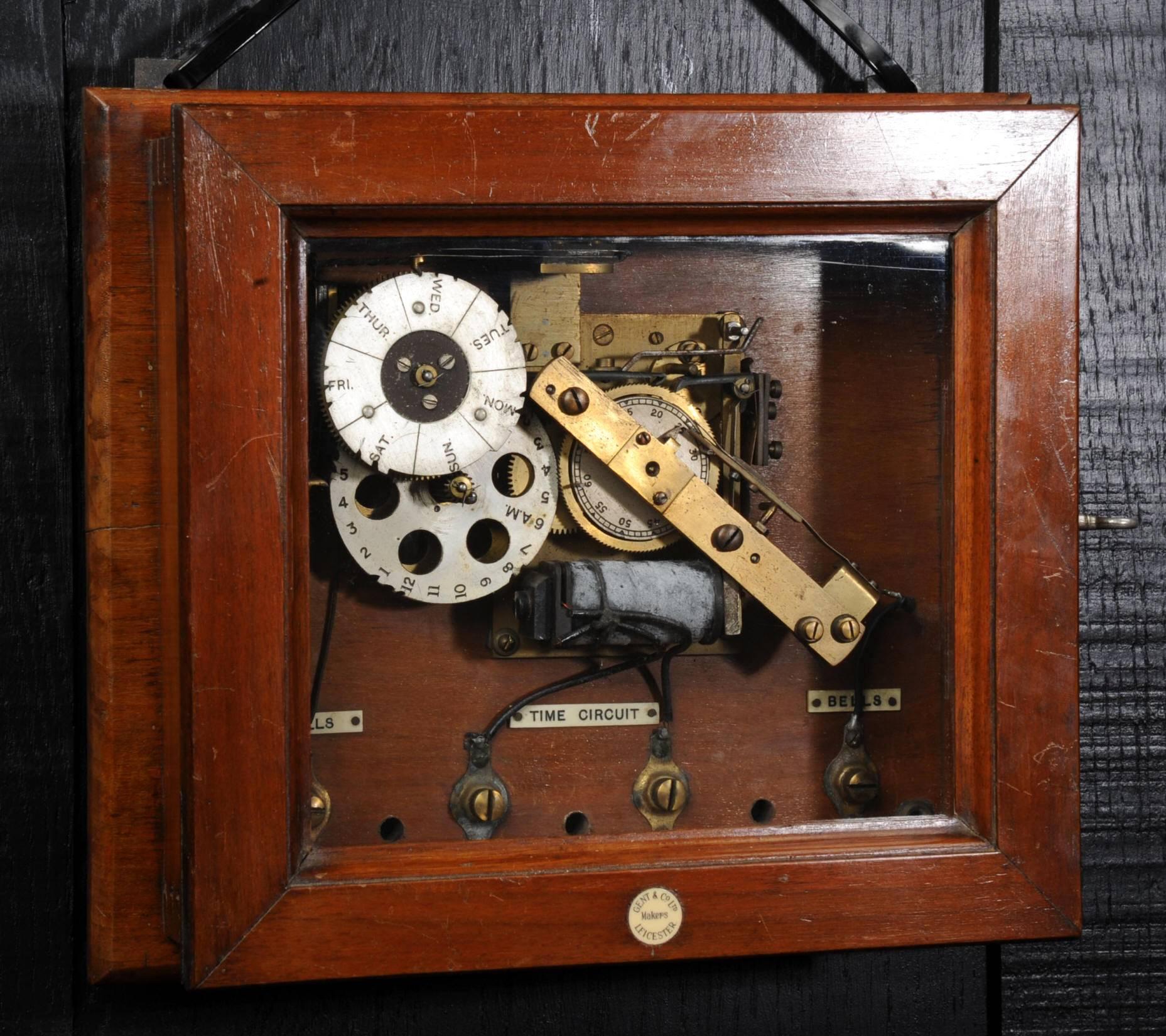 An Industrial Electro-mechanical programmer by Gents of Leicester, part of their Pulsynetic factory time system. Beautifully made in mainly brass in a polished mahogany case, can be wall hung via the two loops. In good ex-industrial condition with a