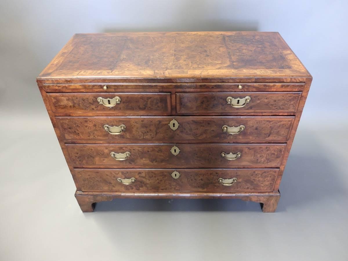 George I burr walnut veneered chest of drawers with brushing slide
crossbanded and herringbone inlay, oak lined drawers, original handles 
circa 1720.