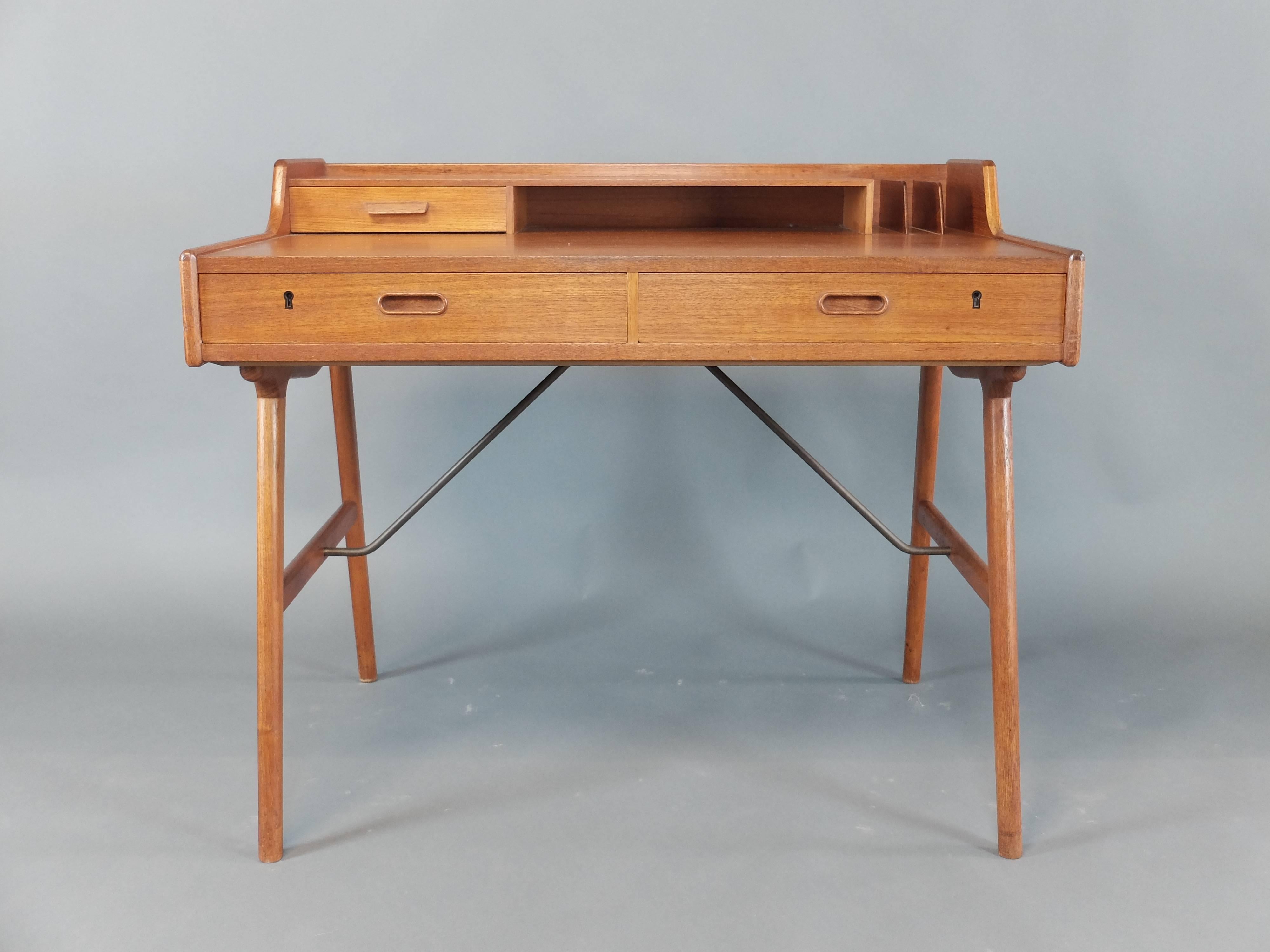A stunning Mid-Century Modern teak desk, model no 65 by Arne Wahl Iversen
Original locks, replacement key
Stamped 'Made in Denmark' '56'
Very good condition, no defects but some very minor age related wear.