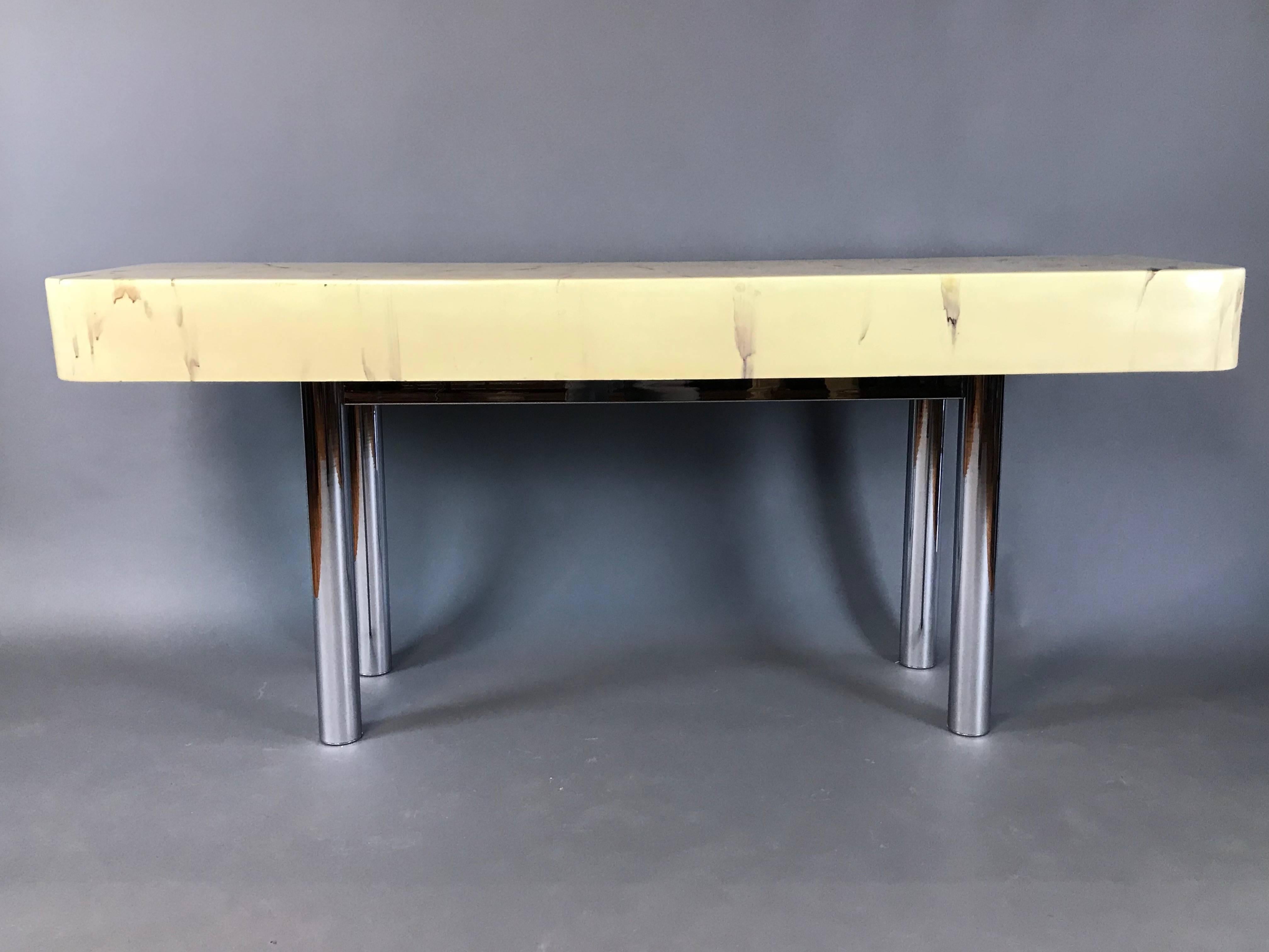 1970s console table

Marbleized resin on wood, polished chrome base, finished on all sides.