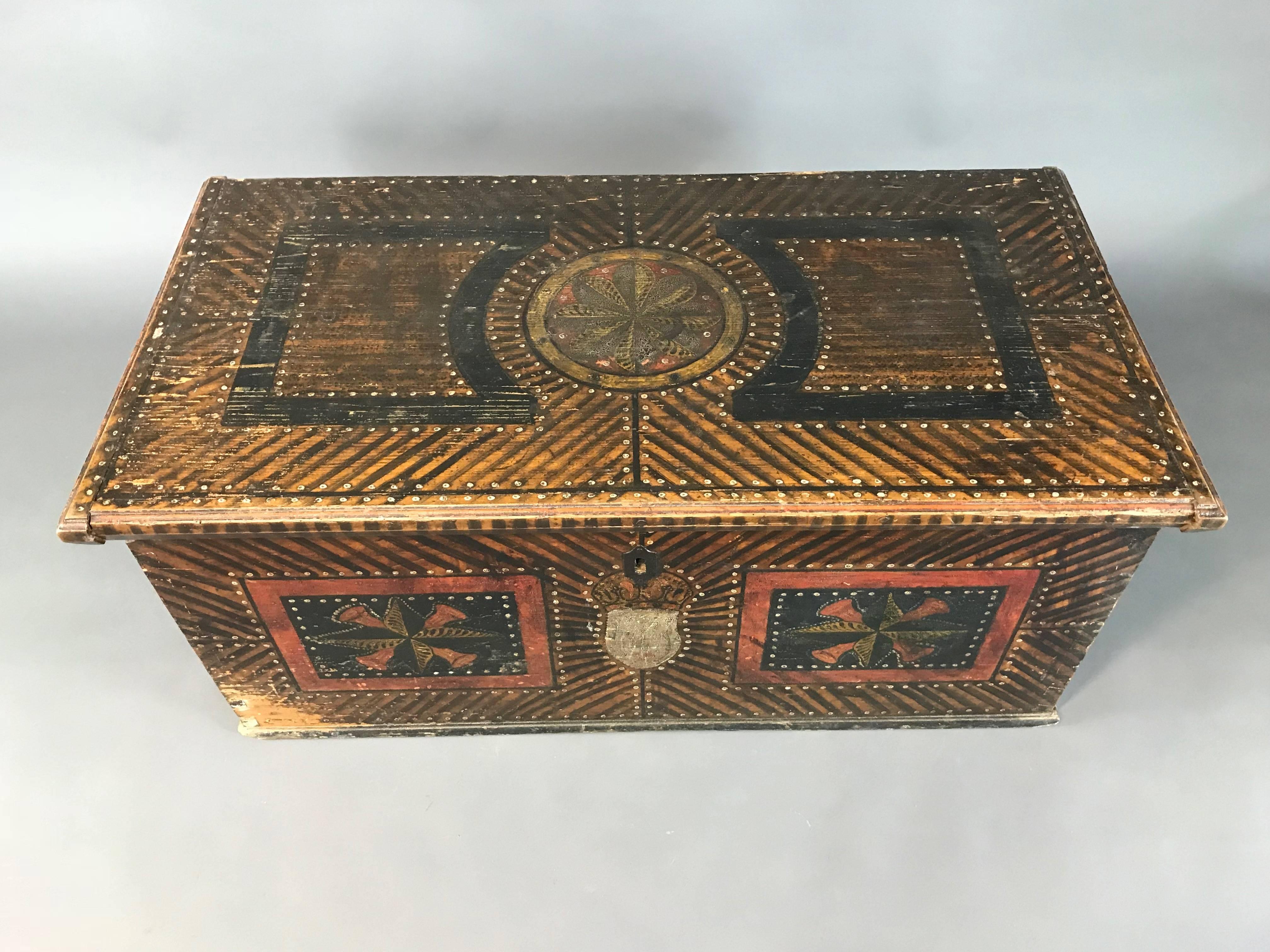 Antique Folk Art painted marriage chest

Central European, circa 1820

Pine painted chest with candle box, original strap hinges and carrying handles.

The lock has been removed.

Condition: Very good, some age related wear.
