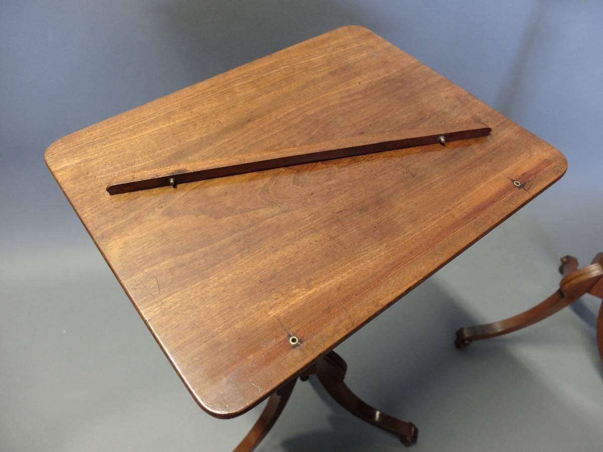 Pair of Regency mahogany tripod occasional tables or music/reading stands with tilting tops. Adjustable in height, revolving removable book rest.


 