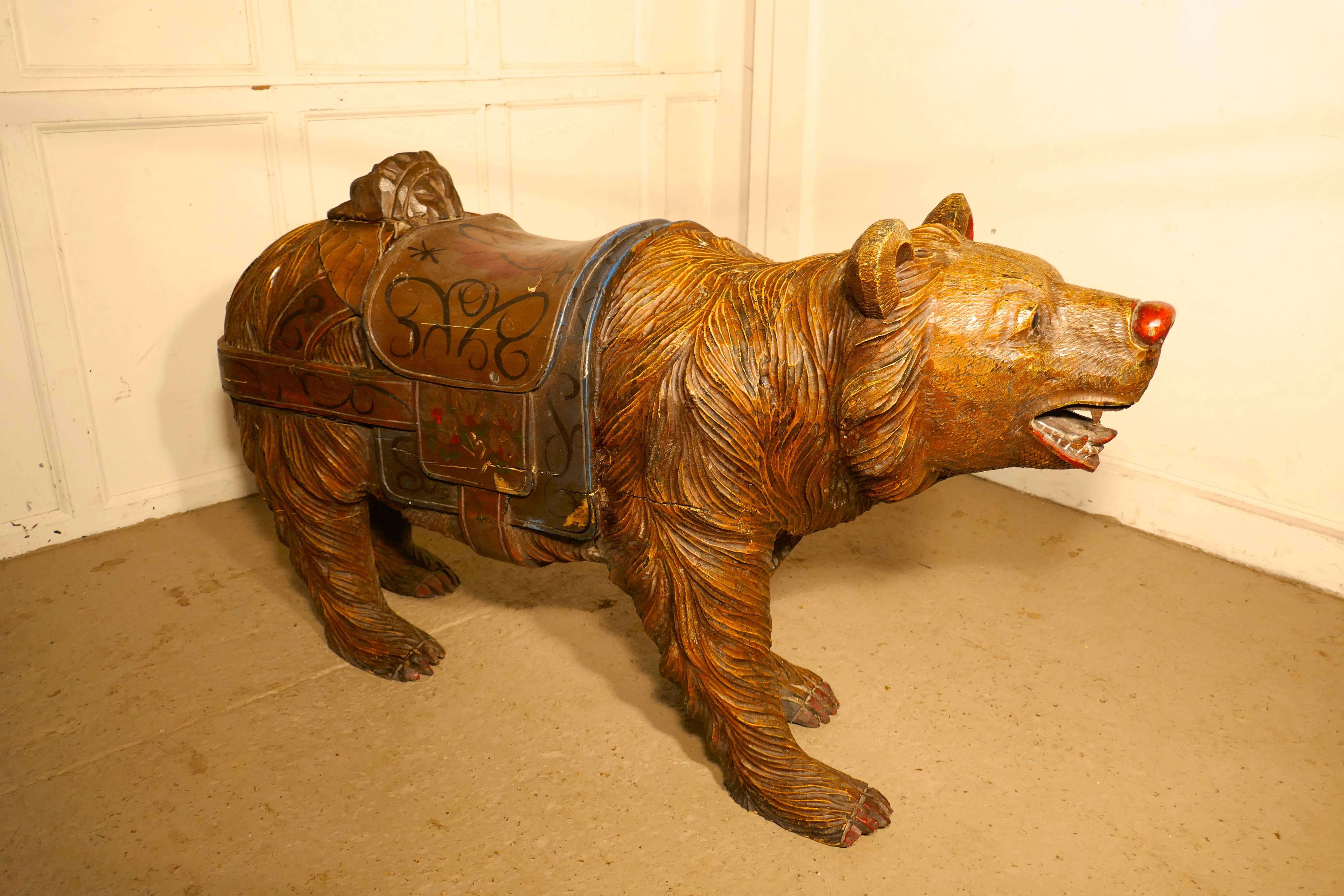 This charming if somewhat fearsome beast is a 19th century carved wooden bear he originates from the Black Forrest and has has detailed carving with Folk Art painted decoration.
Our bear comes from a country merry go round or Carousel, he is made