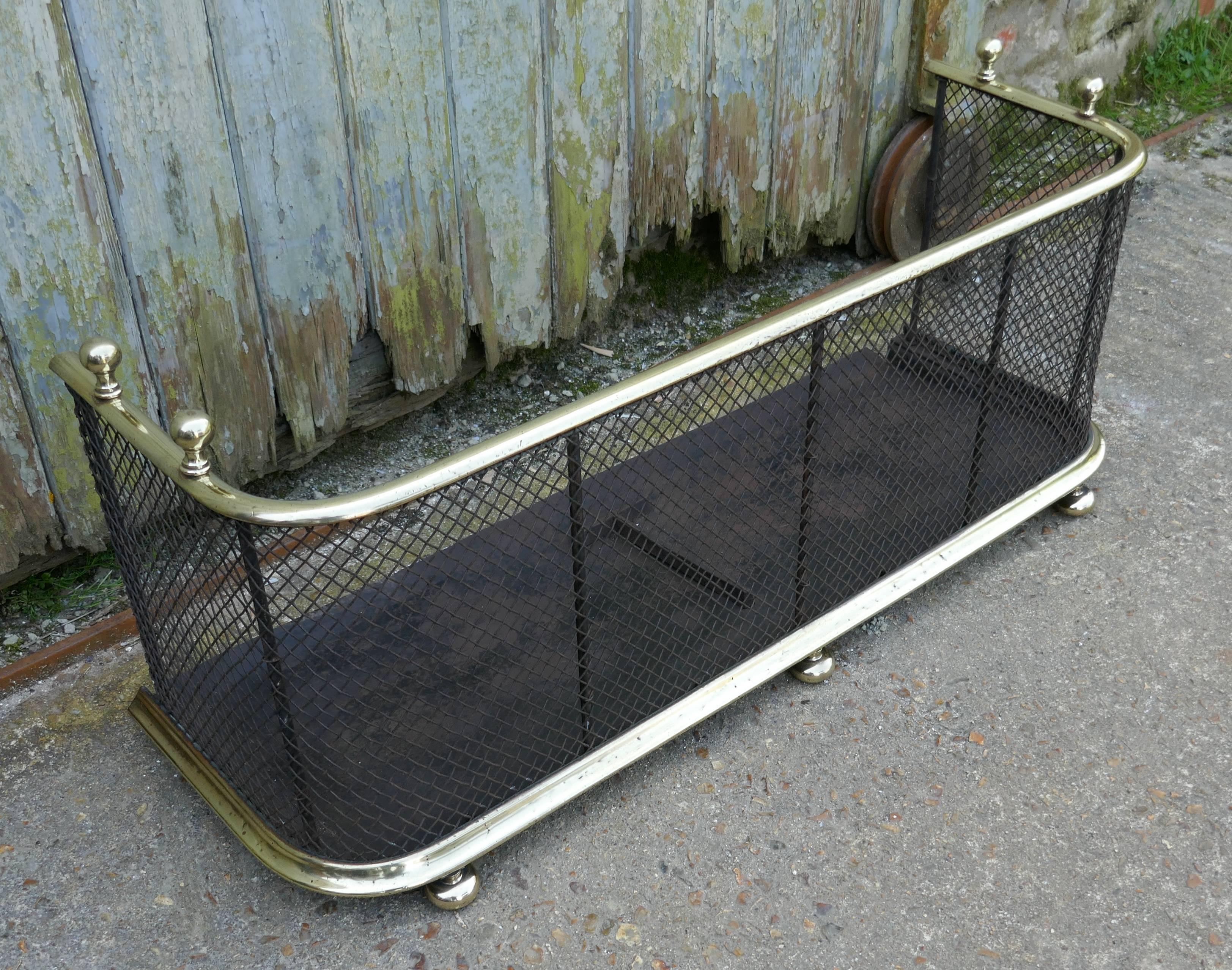 A Victorian antique fire guard often known as a Club Fender, the iron guard has wire mesh and brass rails top and bottom, it has brass knobs on the top and it stands on brass feet, the fender is in good all round condition.
The fender is 15” high,