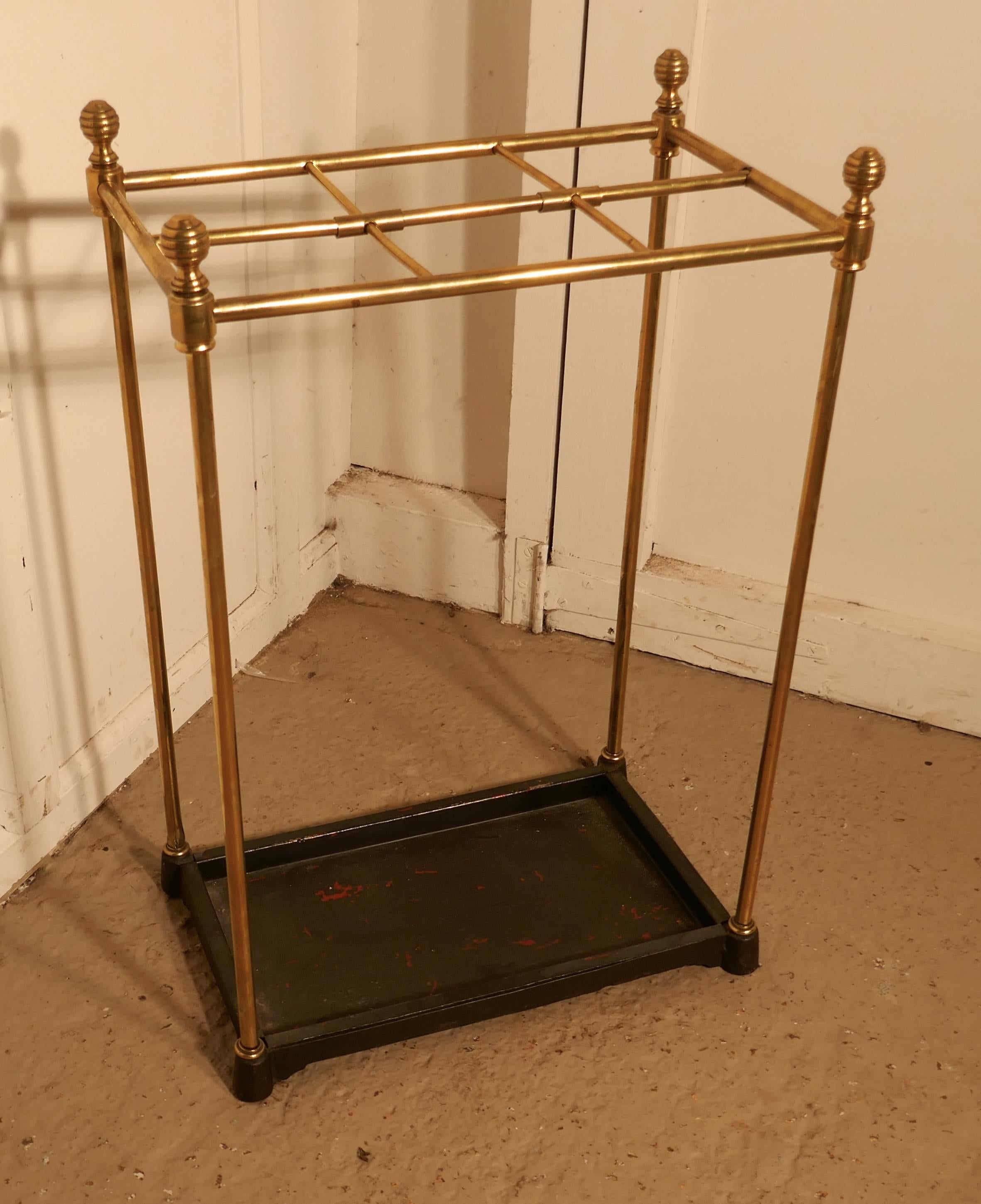 A Victorian brass and cast iron stick stand or umbrella stand


A charming piece, the stand has a brass top divided into 6 sections to hold either walking sticks or umbrellas, the heavy iron base has a removable drip tray
The stand is in good