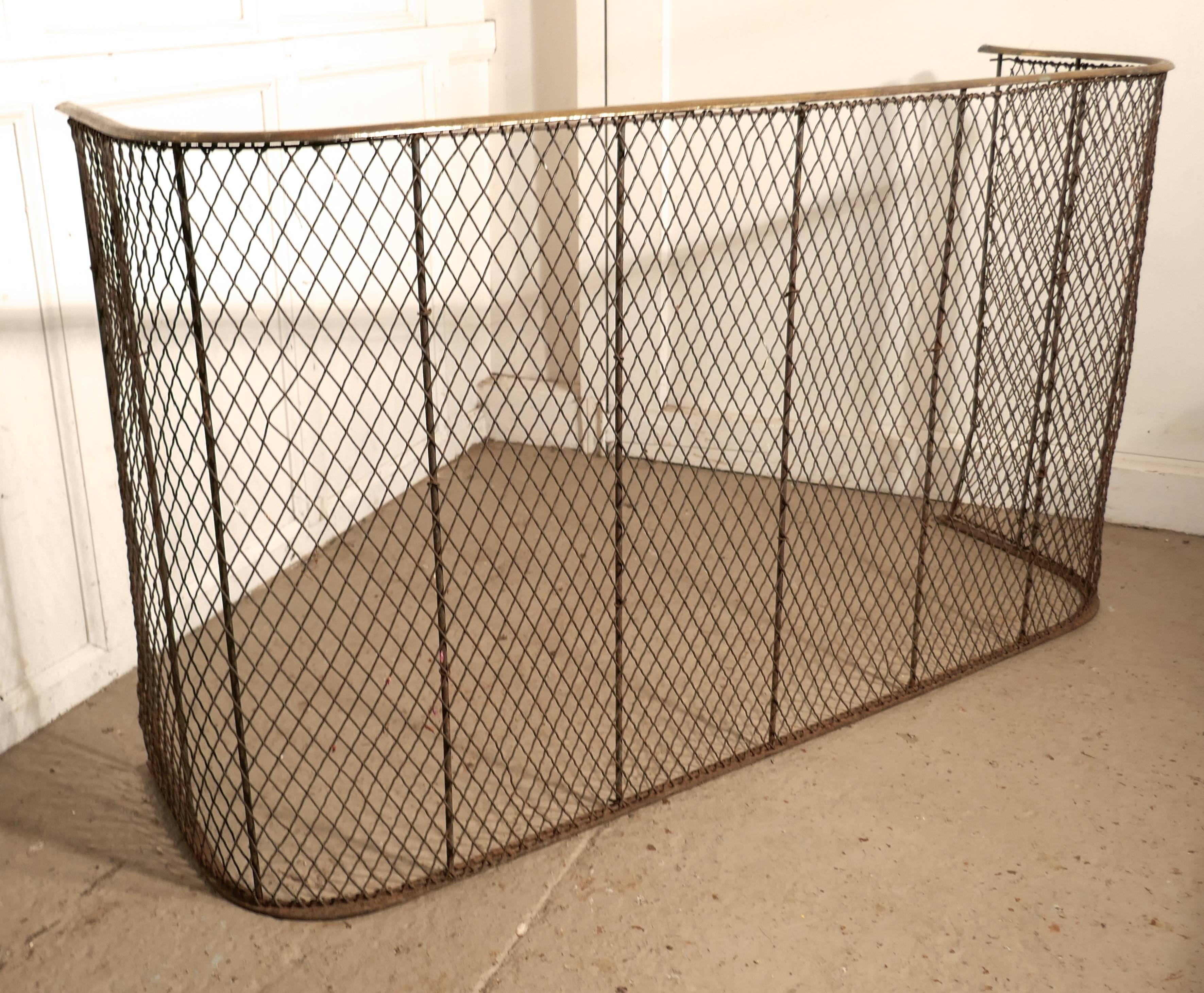 A high Victorian nursery fire guard, brass fender

A large, early Victorian antique fire guard often known as a nursery guard as it completely surrounds the fire
The fender has a slightly curved brass topped rail, with wire mesh, it is in good
