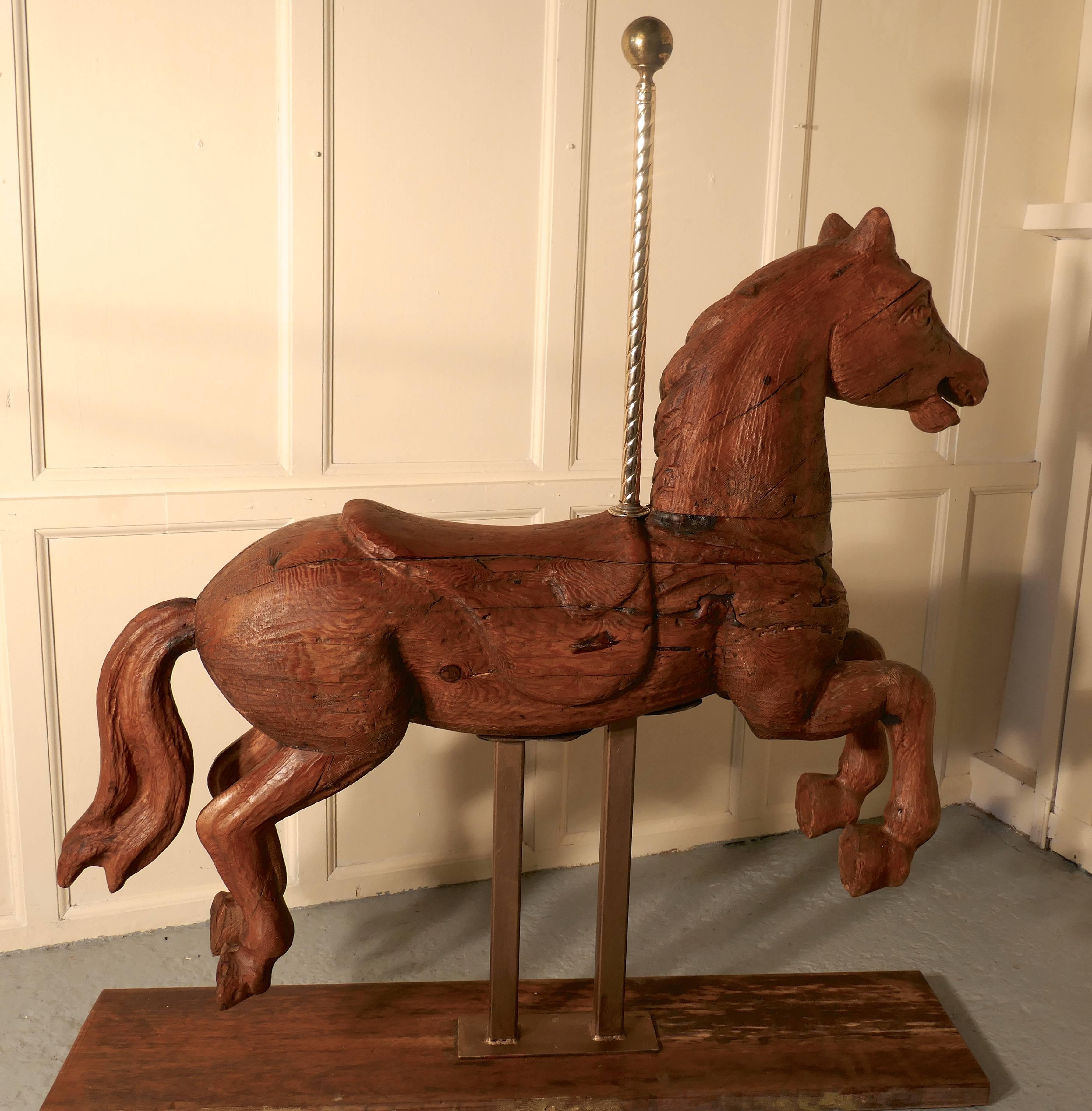 19th century Spanish wooden carousel galloper or fair ground horse

An original the 19th century fair ground galloper, made in solid wood, the paint has all been worn away leaving a wonderful weather-beaten aged finish.
The horse is posed in full