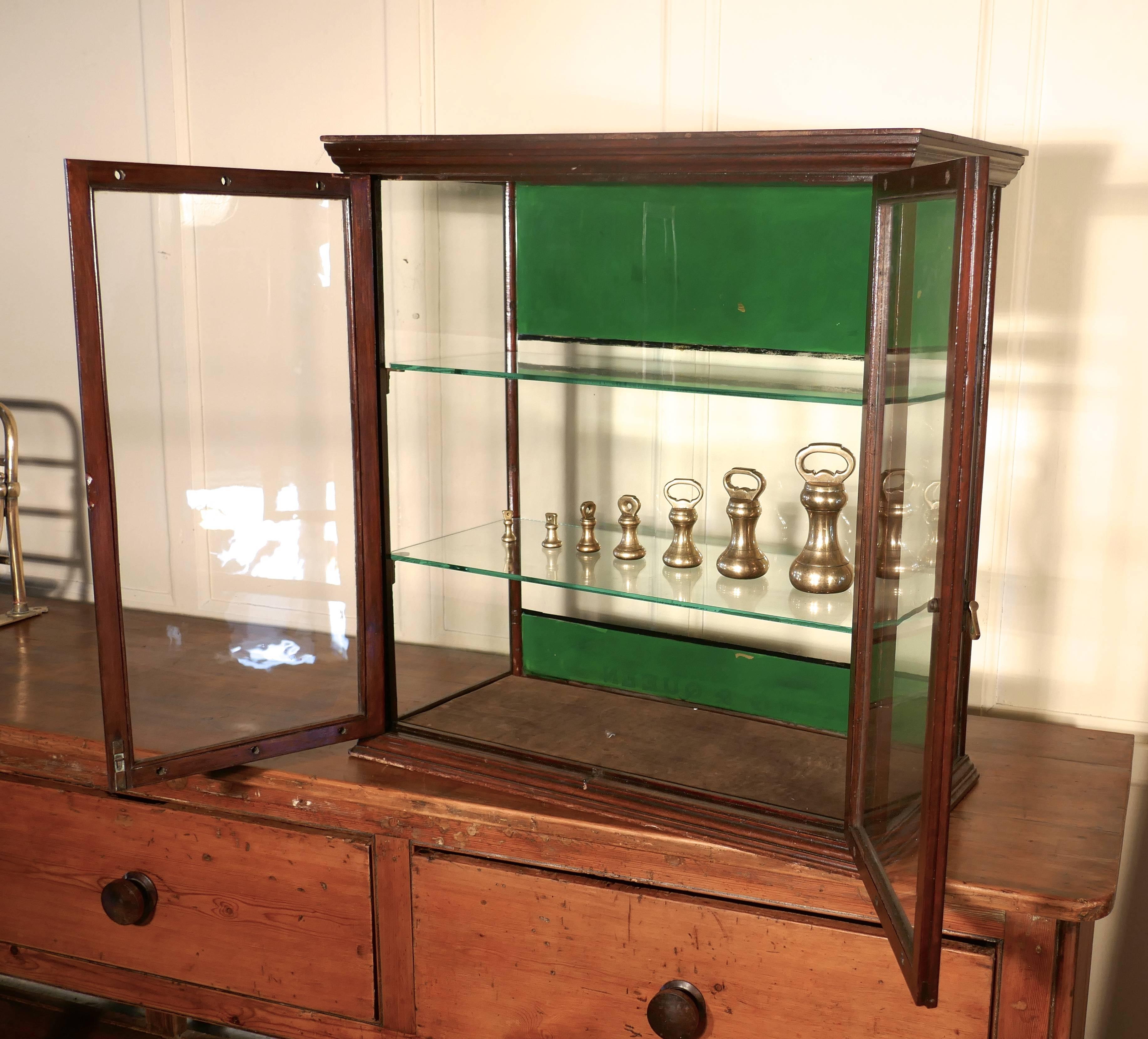 Victorian counter top shop display cabinet, sweet shop 

This glazed shop display cabinet is made mahogany, it has advertising banners for Fry’s painted across the top and bottom at the front, these are in the original green color used by Fry’s,