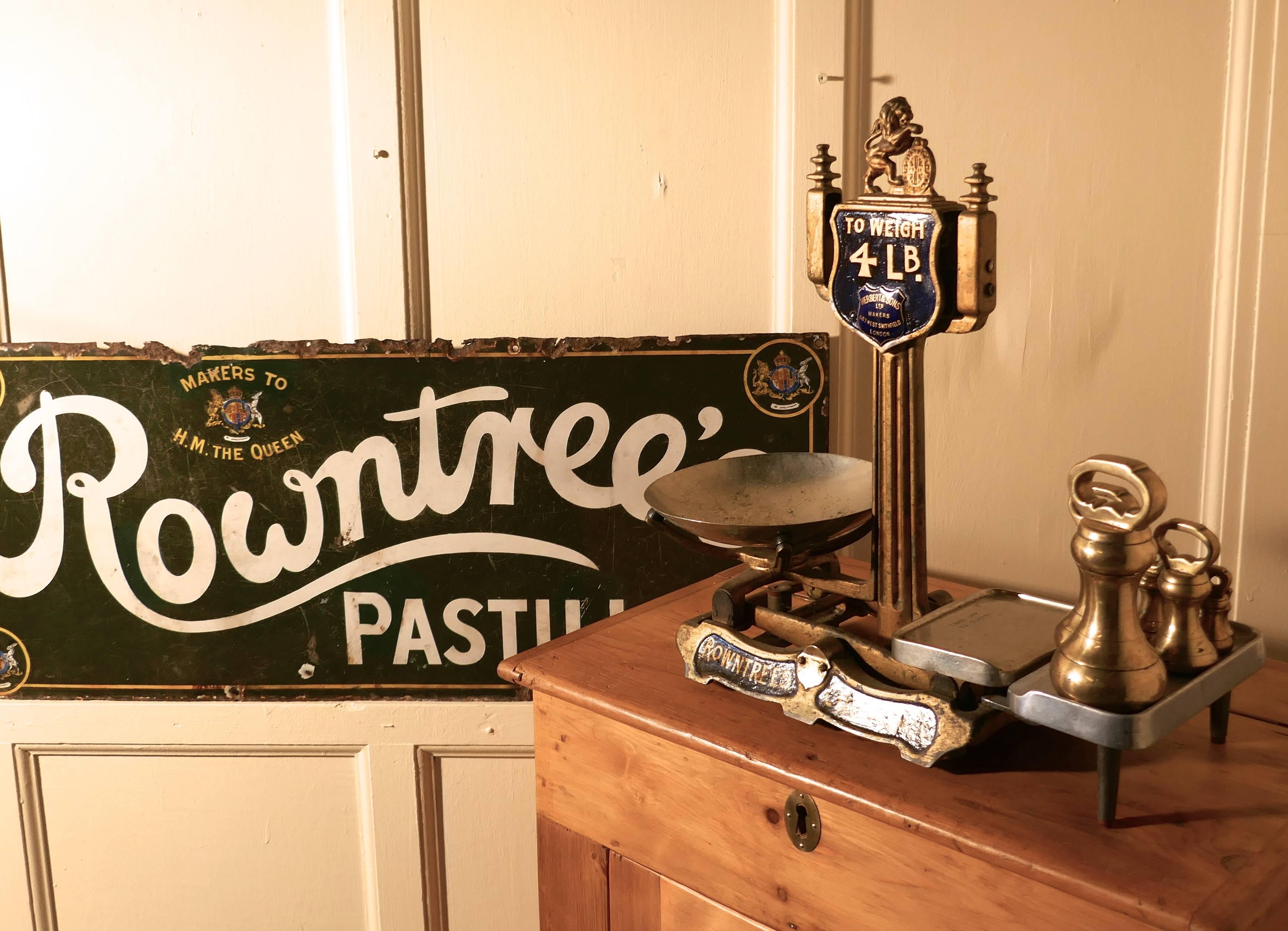 A 19th century set of Rowntree’s sweetshop scales with brass bell weights

This a very rare find, the scales are cast iron with steel pans, the scales have an advertising banner along the bottom of the scale and at the top there is an enamel badge