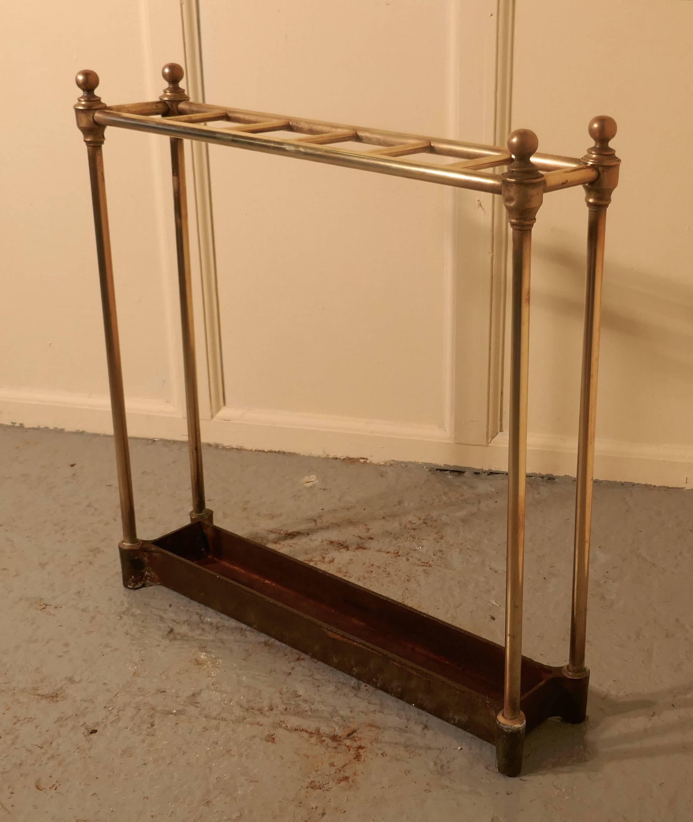 French 19th century brass and iron stick stand or umbrella stand

 A charming piece, the stand has a brass top divided into six sections to hold either walking sticks or umbrellas, it has a very the heavy iron base
Measure: The stand is 25” high,