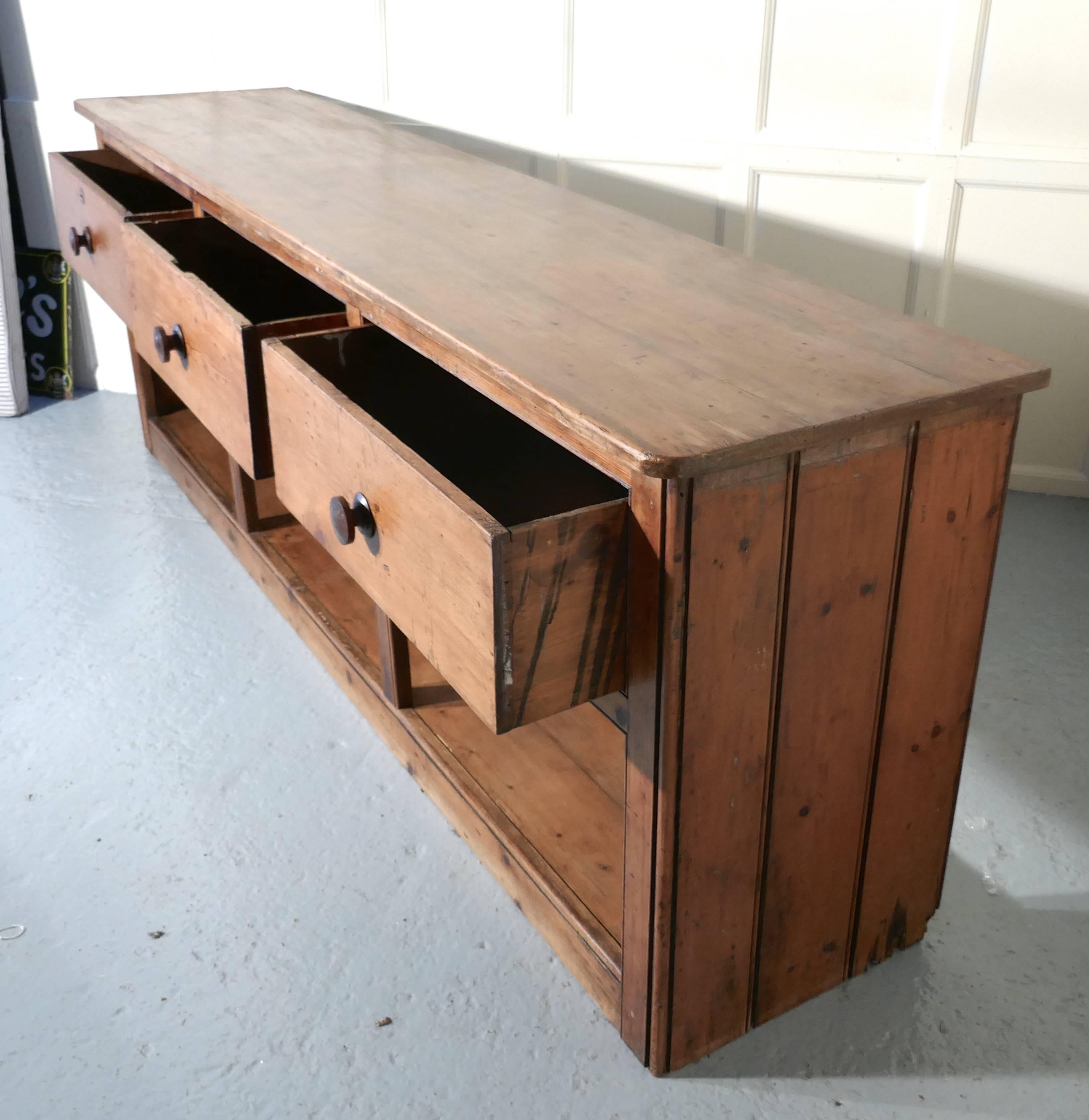 Large Georgian rustic pine pot board dresser

This lovely old dresser has a 1” thick solid pine plank top, it has solid planked sides and there are three deep heavy pine drawers with turned fruitwood handles, at the bottom there is a solid pine