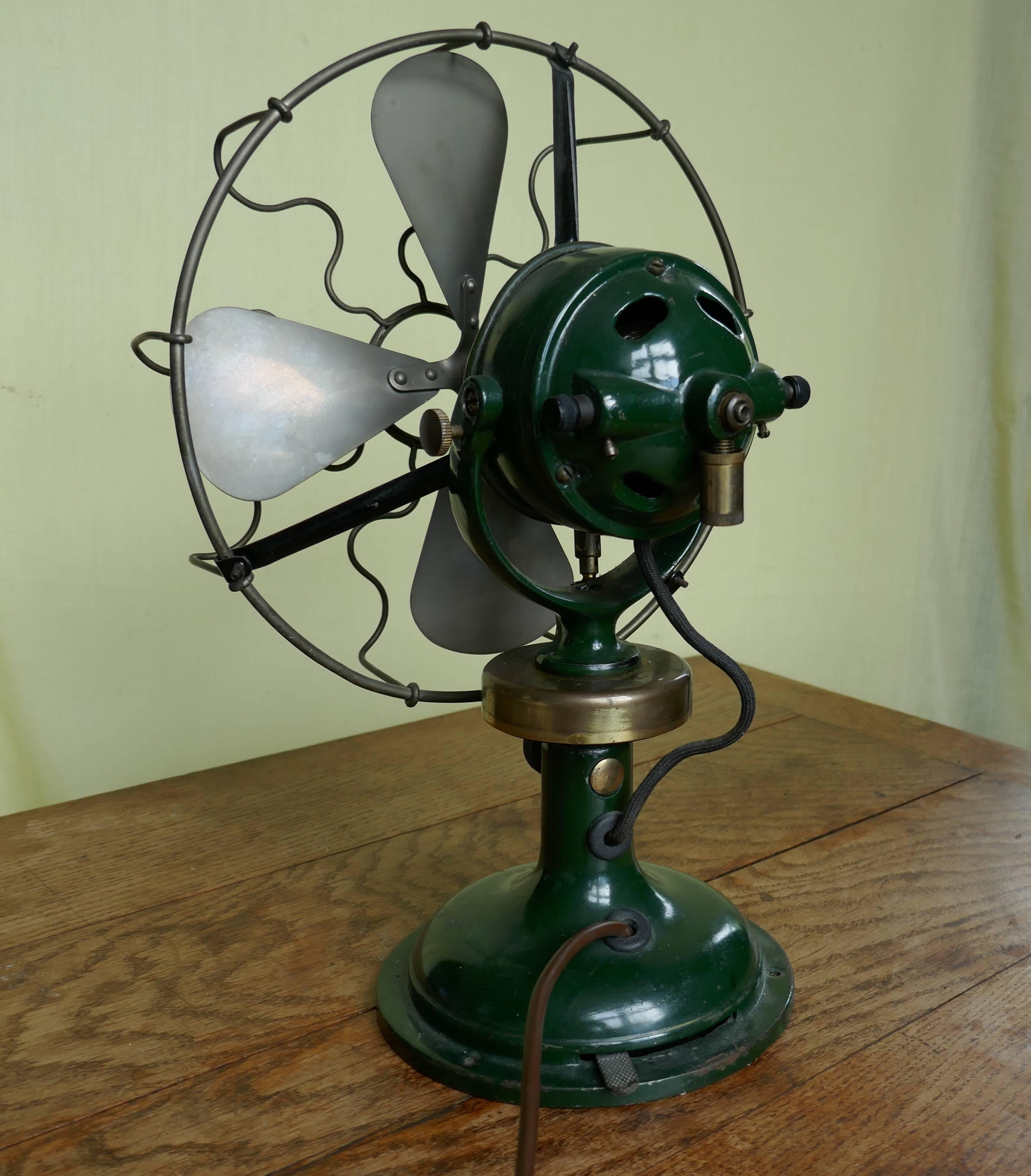 Dark green 1920s Art Deco electric fan, Industrial antique 

A very stylish good looking piece, in shiny dark green with brass fittings

This piece looks to be in very good condition, the motor responds when connected to the electric supply but