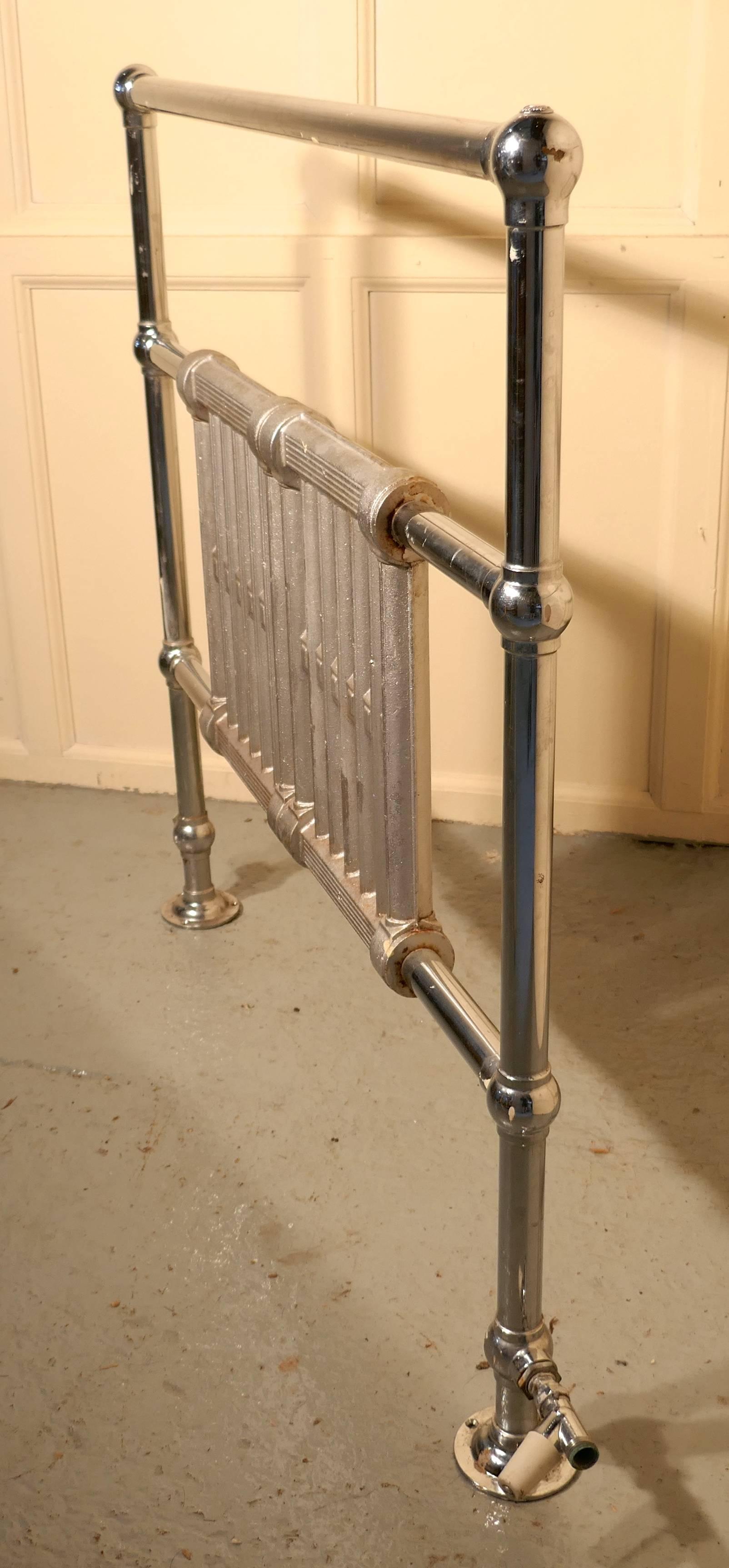 Art Deco solid chrome on brass towel rail radiator

A handsome piece is in very good condition, it is made from 2” chrome on brass tube and has a substantial cast iron radiator in the centre. The towel rail will Stand on its own so it could be