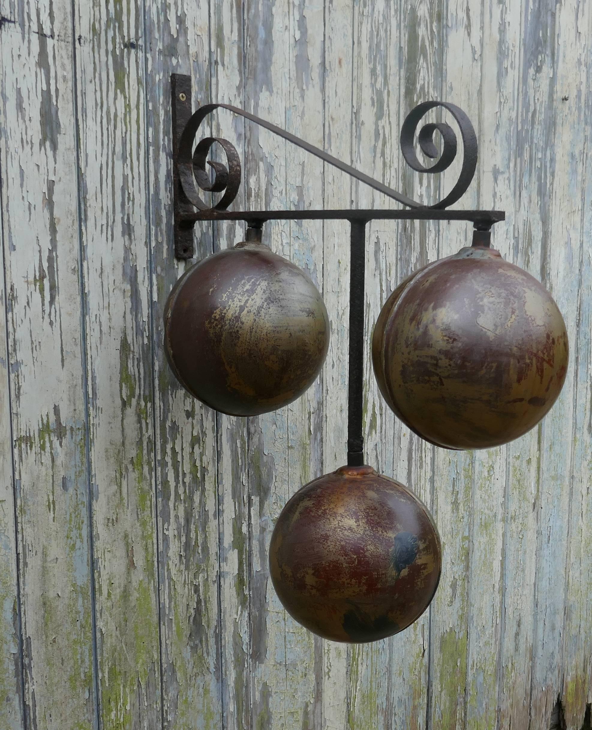 Old Pawn Broker’s three balls trade sign

Here is a piece from the past, a Pawn Broker’s Three balls, the sign is on a wrought iron wall bracket and the balls are a brass colour, this is a good large piece it is sound though there is a dent on one