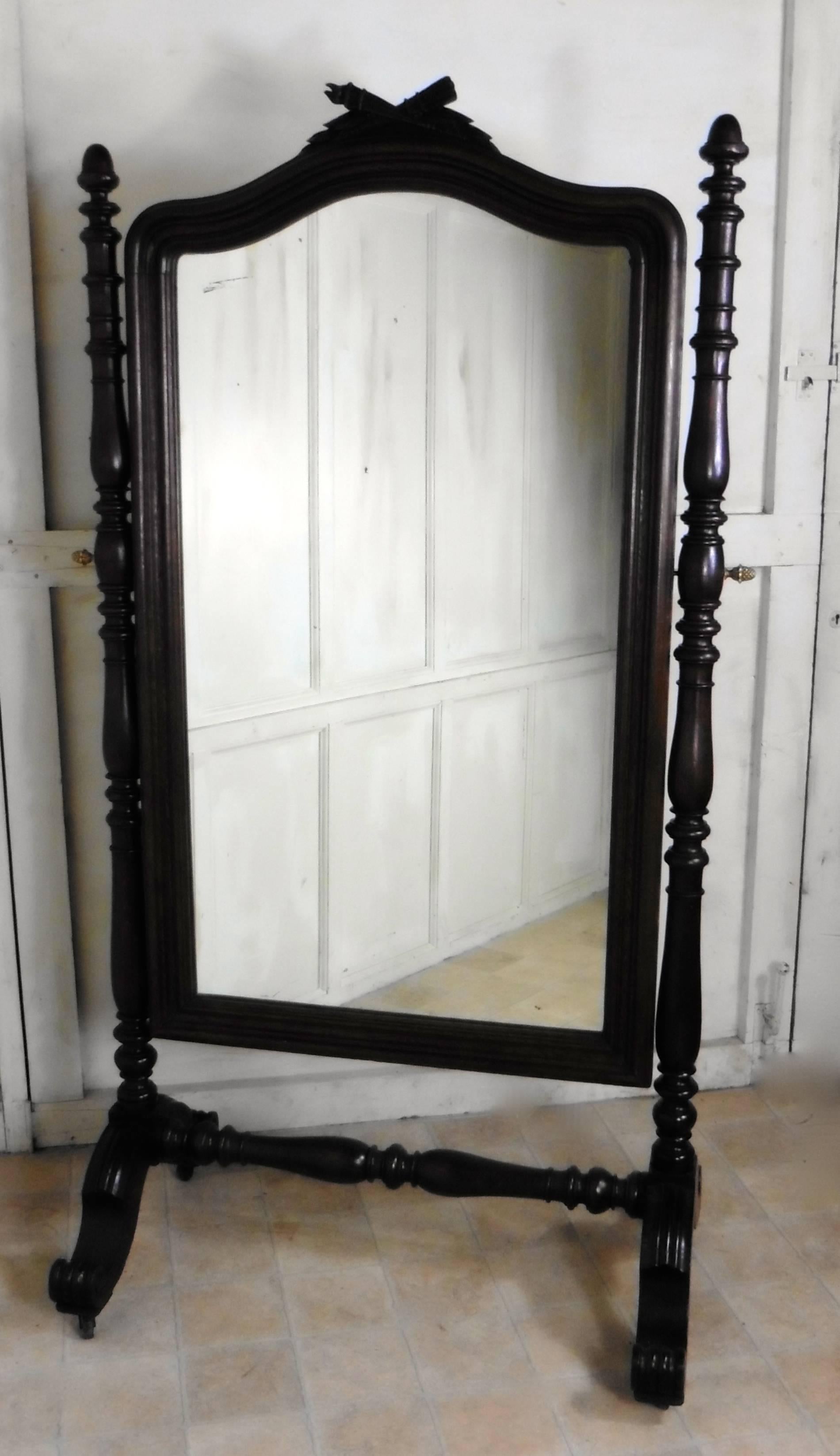 Superb 19th century Breton oak cheval mirror 

This impressive mirror was originally part of a French bedroom set, it
has a solid oak frame, and the mirror has an arched and decorated top, it sits firmly in its stand and swivels for maximum