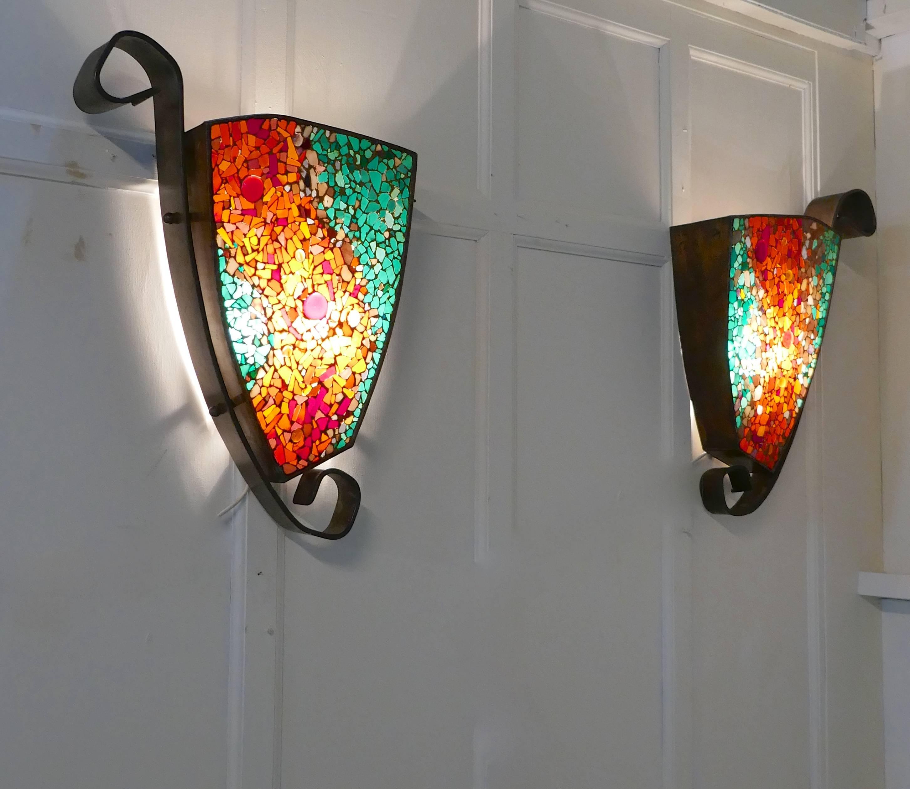 Set of four extra large Gothic Art Deco glass and copper wall lights

These are very large stylish lamps, they are almost 30” tall, the shades come from North Africa and are made from mosaic glass
The glass mosaic has a contemporary flowing