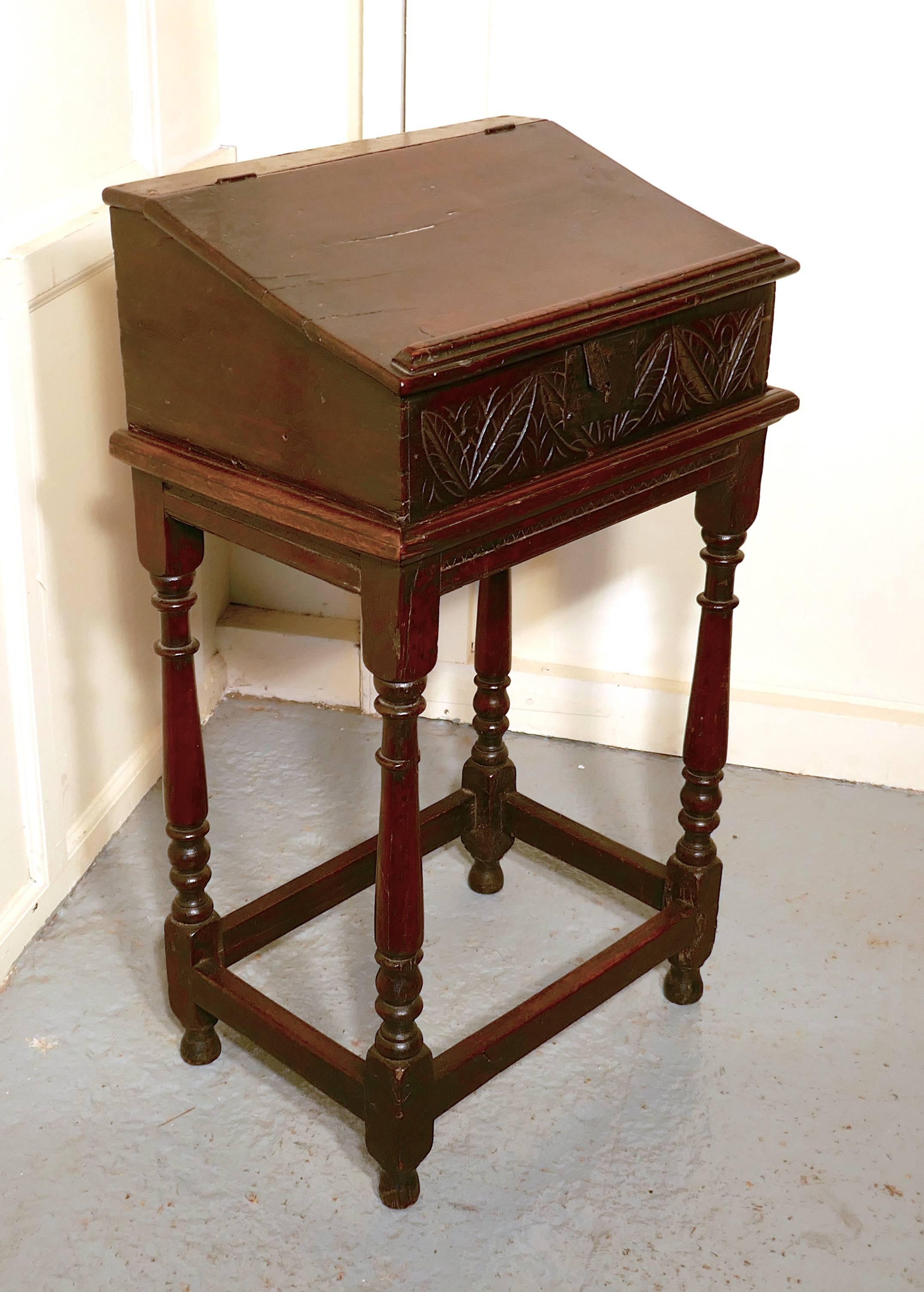 17th century carved oak bible reading slope desk on stand


This is a lovely old Bible box, the desk is in two pieces, the top section would have been for keeping the family bible in. With the lid closed, it can be used as a reading Stand or