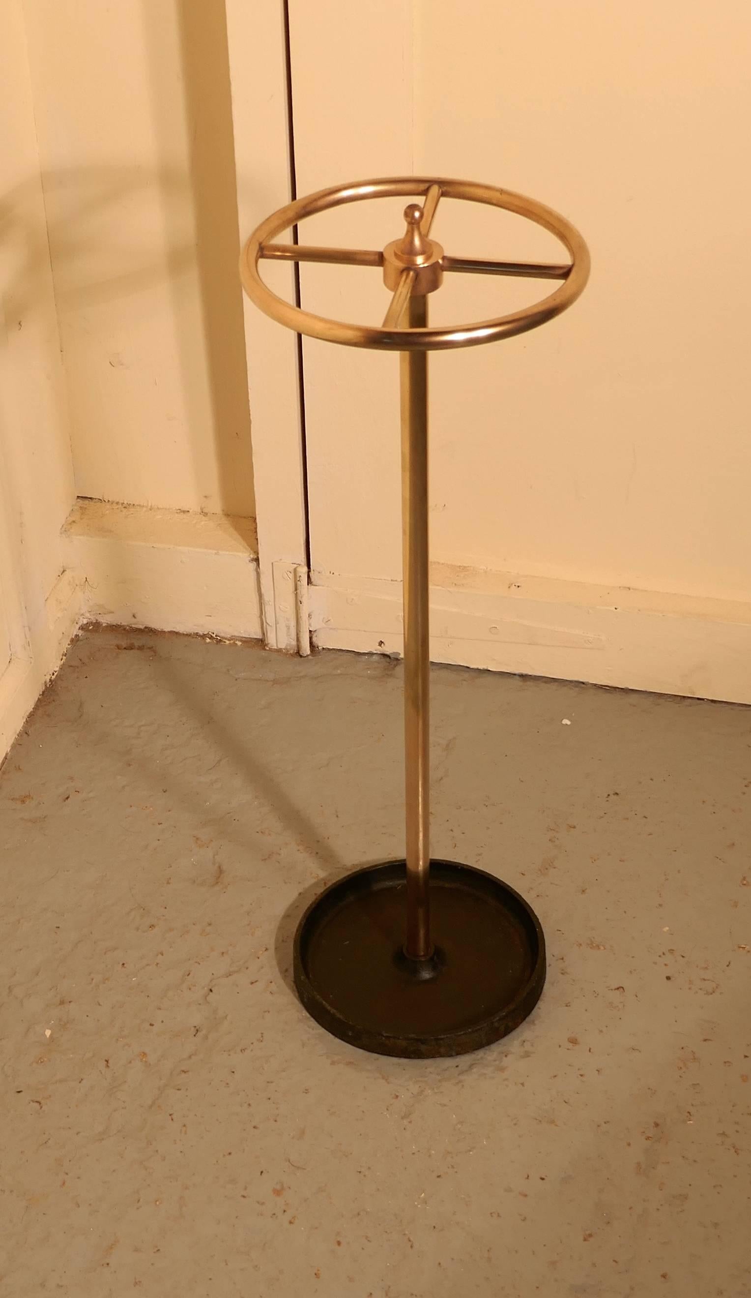A Victorian brass and cast iron walking stick stand or umbrella stand

A charming piece, the stand is an unusual circular shape, it has a brass top divided into four sections to hold either walking sticks or umbrellas, the heavy iron base is also