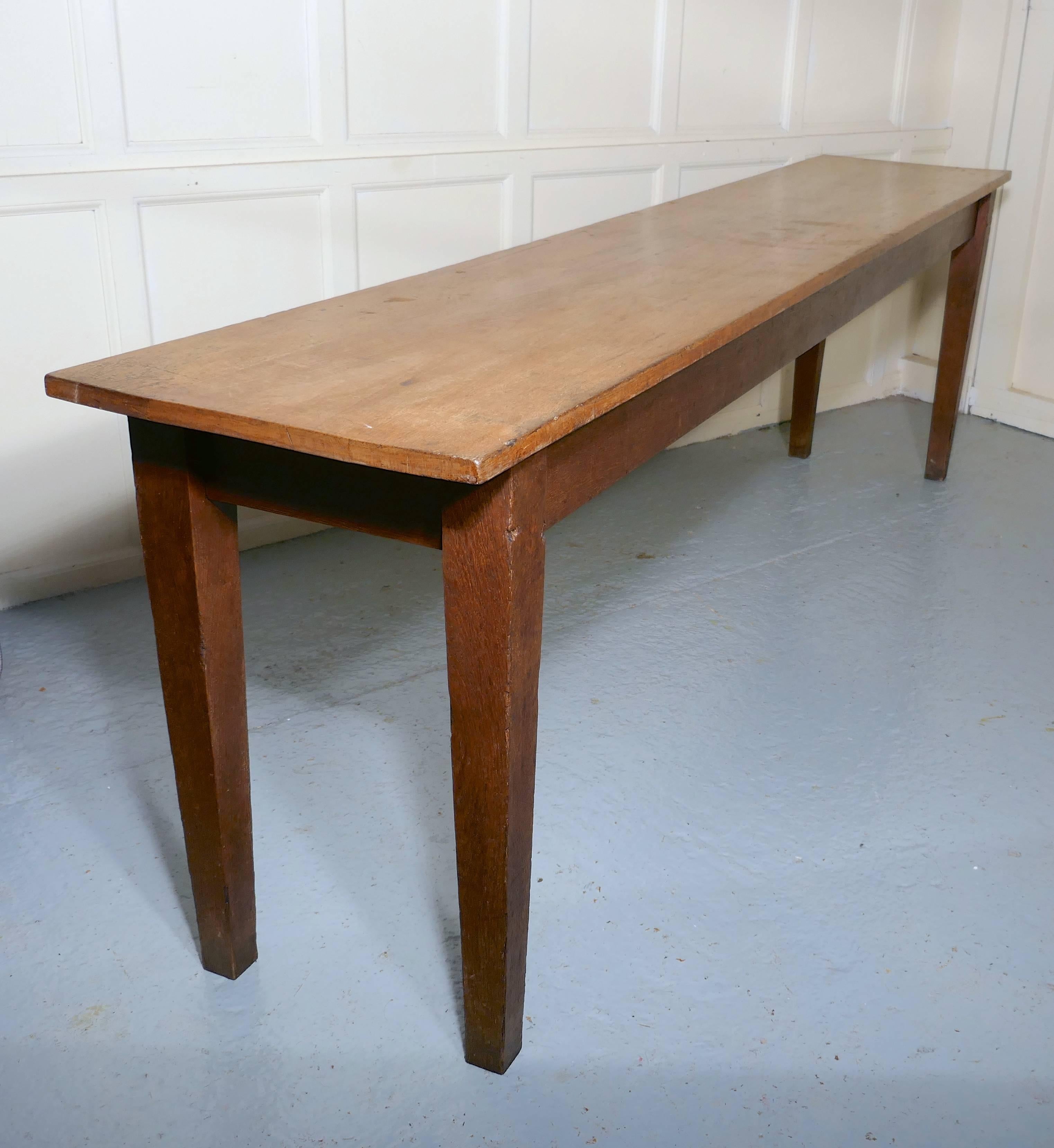 Long narrow golden oak farmhouse kitchen table
 
A lovely golden oak kitchen table, an ideal size for a long narrow kitchen or as a serving table in the dining room, the legs are in their original age darkened stain, the top has been cleaned and