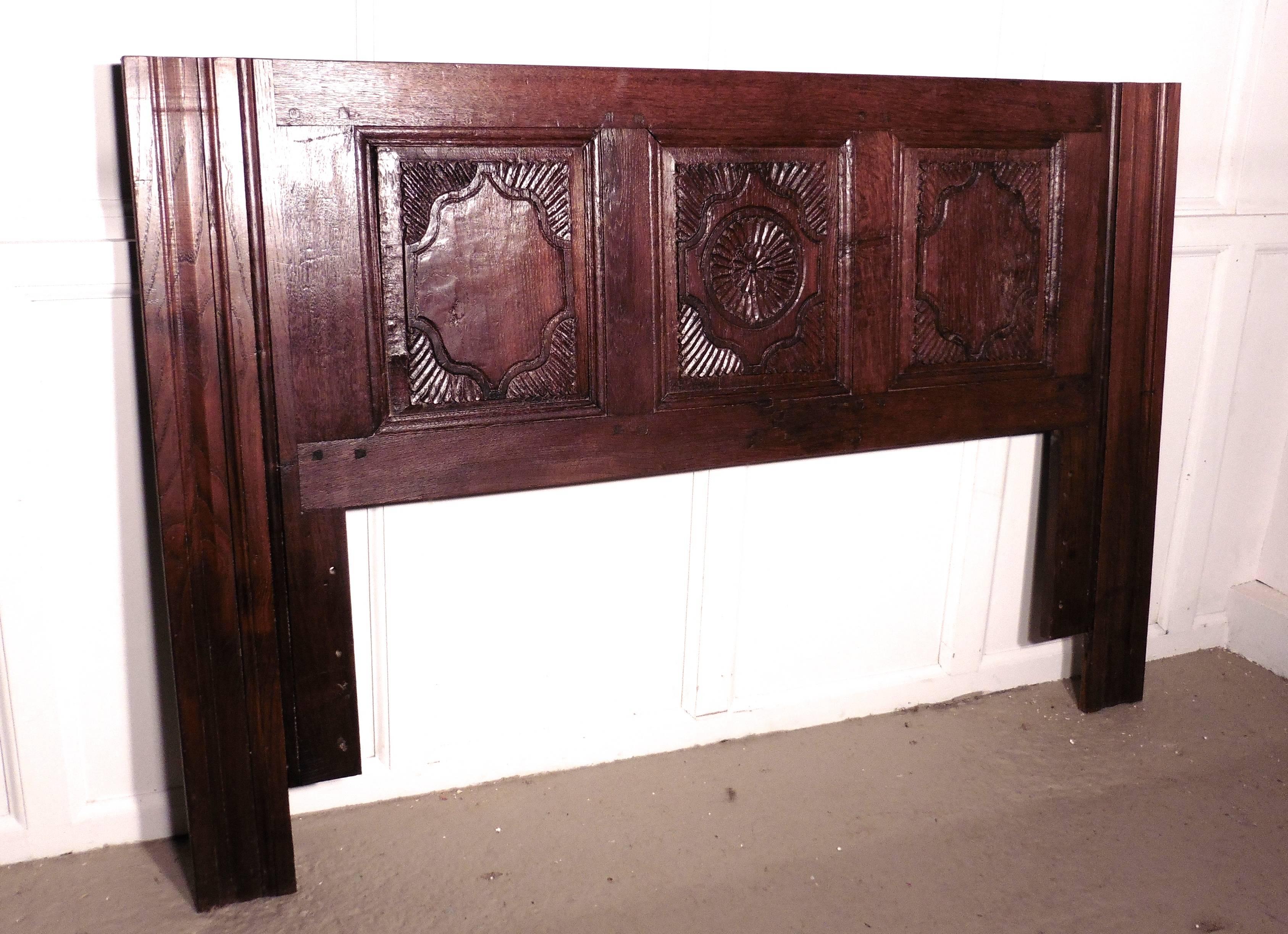 French Gothic carved oak bed head board

This is a lovely old piece, the headboard has been made from a piece of 18th century French carved furniture, the headboard can be fixed to a wall and would be useable with a divan bed or similar to make