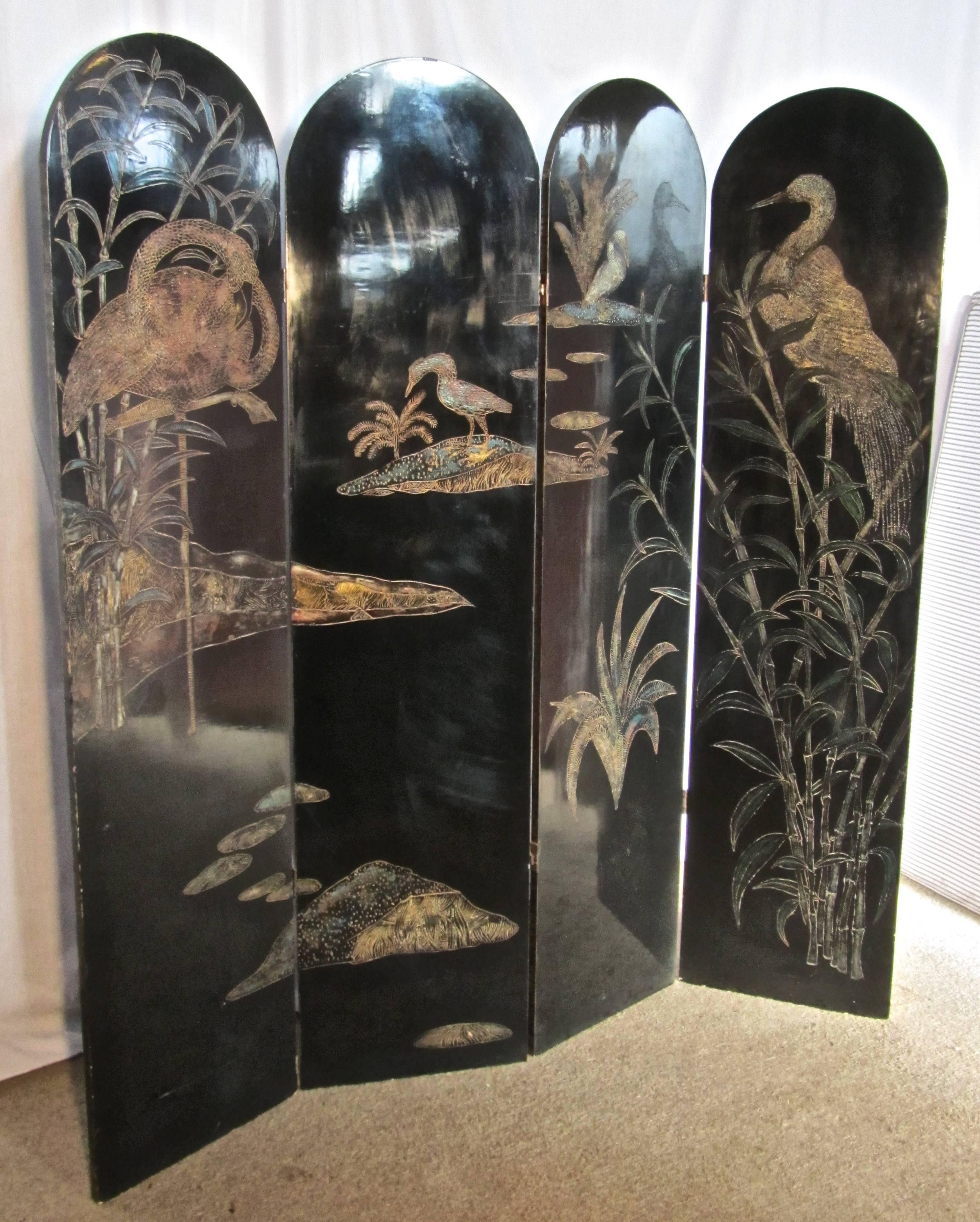 A 19th century black lacquer chinoiserie four fold Japanese screen
 

This is a very heavy piece, it is made in wood and has been lacquered and carved, the theme is water birds, flamingos herons and islands
The carving is highlighted with