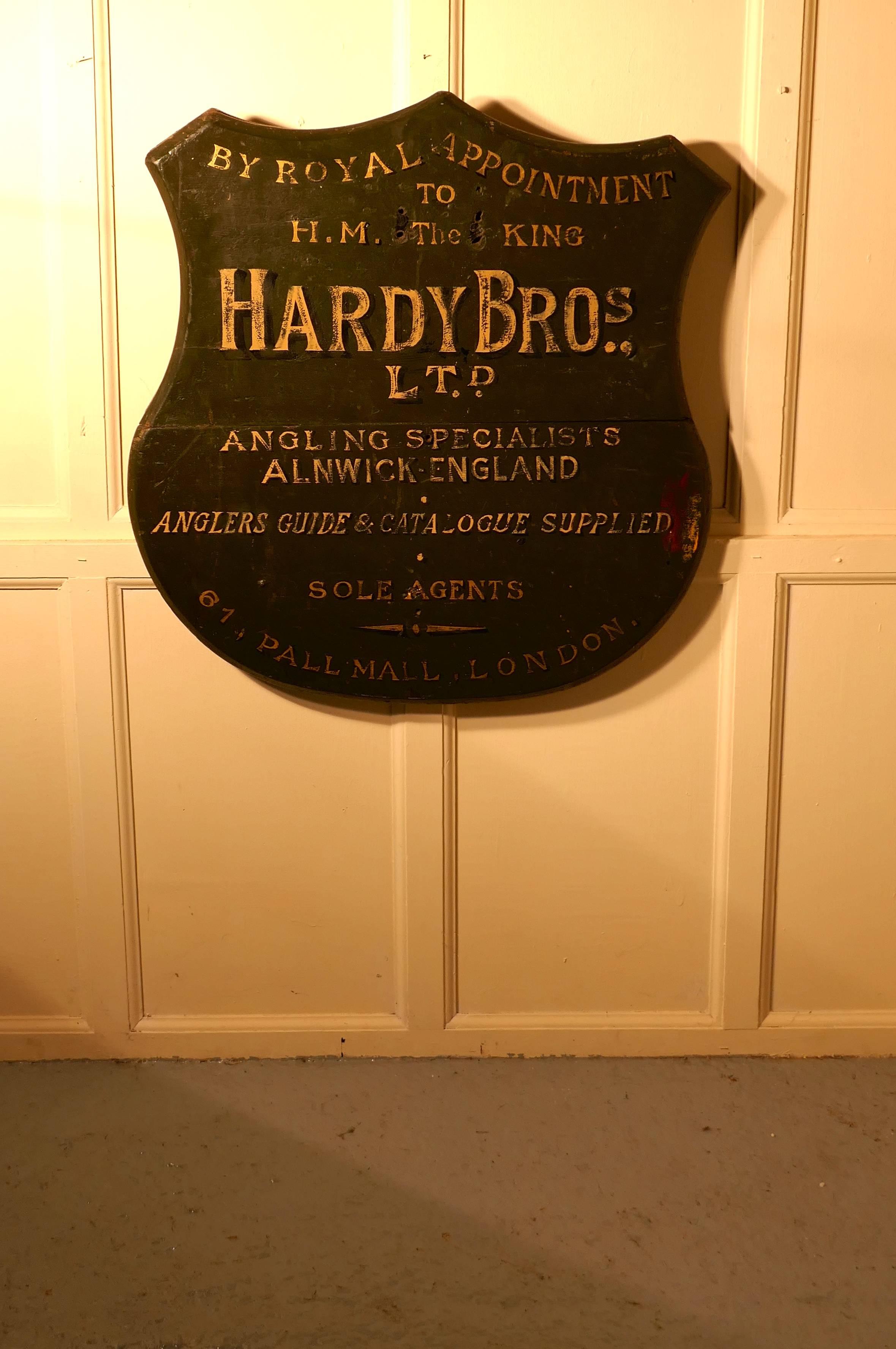 Hardy Bros Ltd, angling specialists large shield wall plaque 

Rare piece indeed this large wooden wall plaque was painted for the London shop which opened in 1907, it has the Royal appointment to HM the King at the top
The plaque has gold