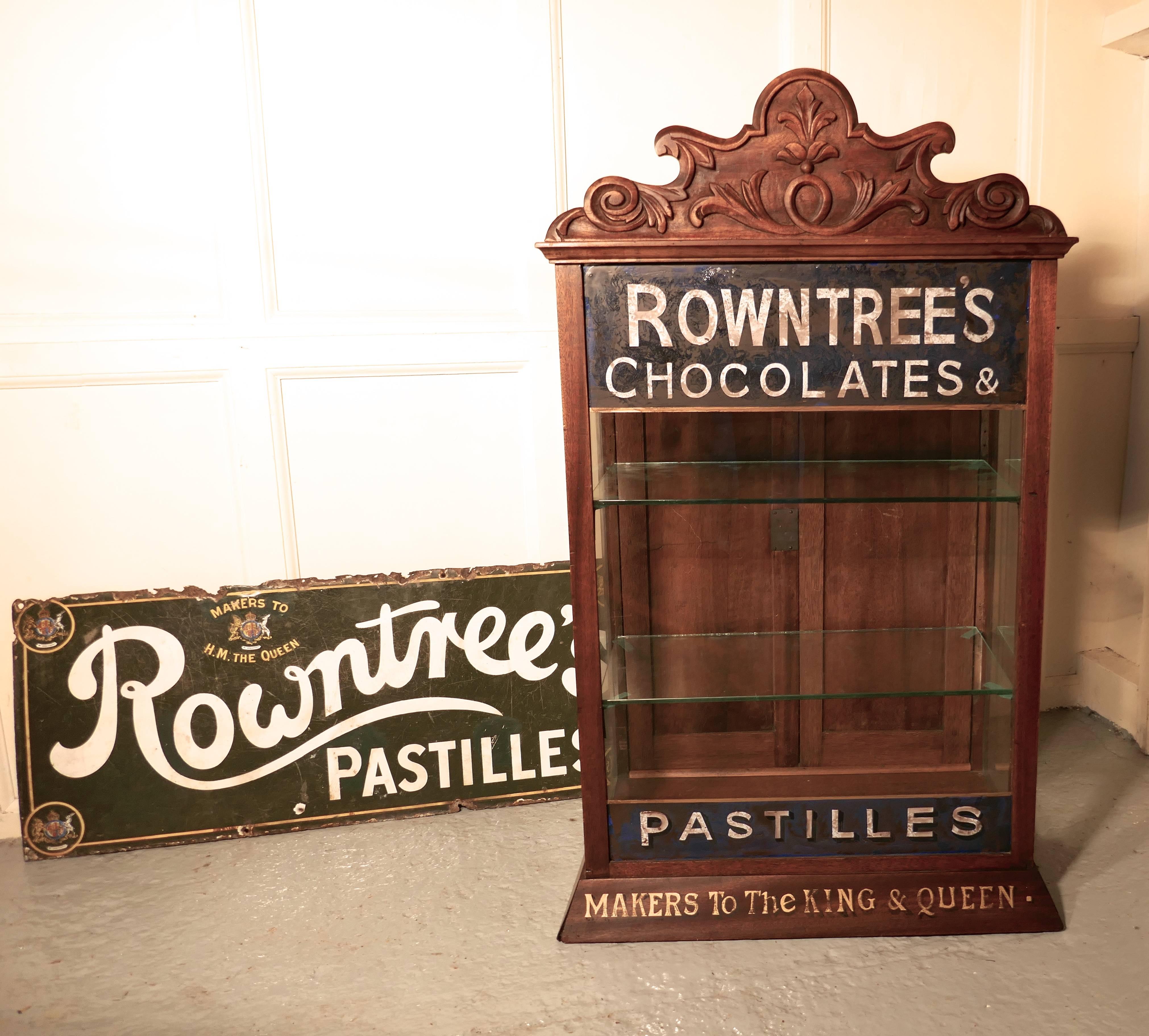 Rountree’s sweet shop display cabinet 

This glazed advertising shop display cabinet is made in walnut, the cabinet has a rather grand carved gallery and is set on a sloping plinth. The Glass on the front of the cabinet is painted with rowntree’s