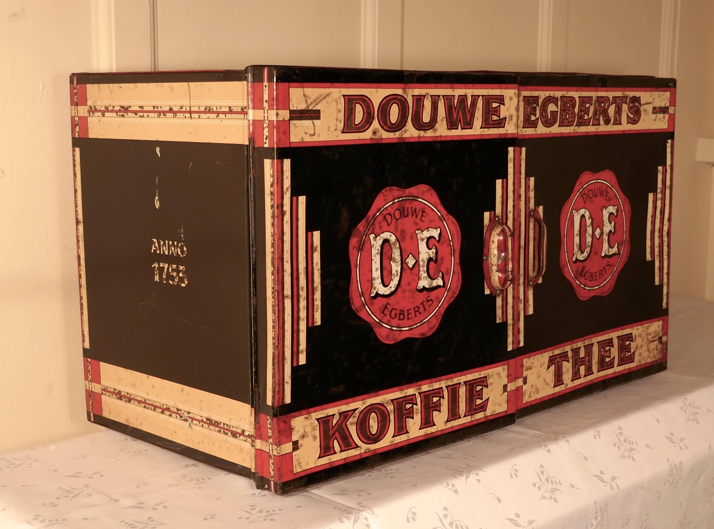 Large Art Deco grocers tolewear double coffee and tea canister

This is a classic of Art Deco design, the decoration is very much in the Odeon style typical of toleware of this period
The Dowe Egbert double display tin comes from Holland
The tin