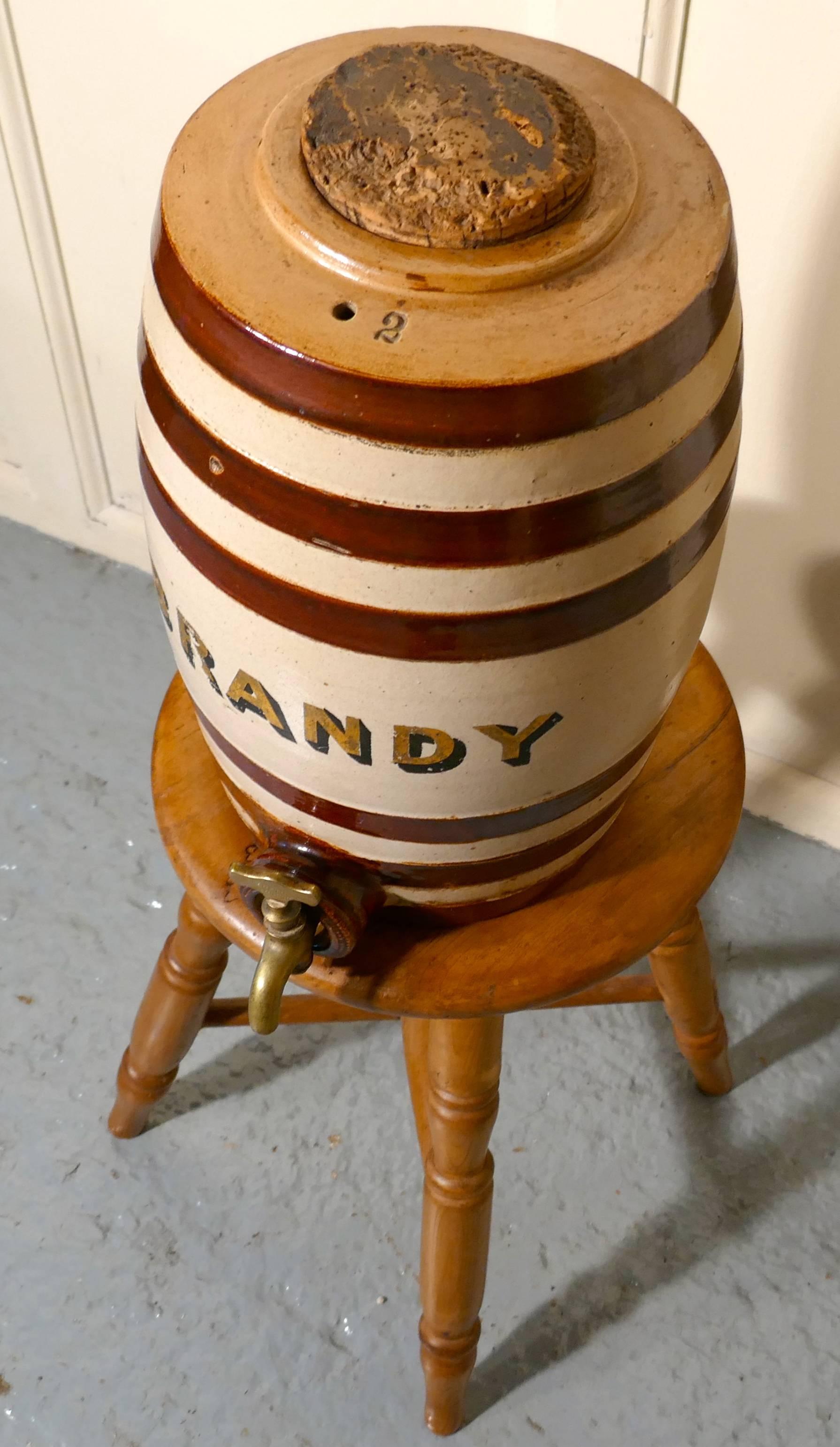 A 19th century stoneware brandy barrel,

A large stoneware brandy barrel it is in nice condition with traditional hooped design, it has a cork lid and comes with its original brass tap at the bottom.
It would make a great addition to any kitchen