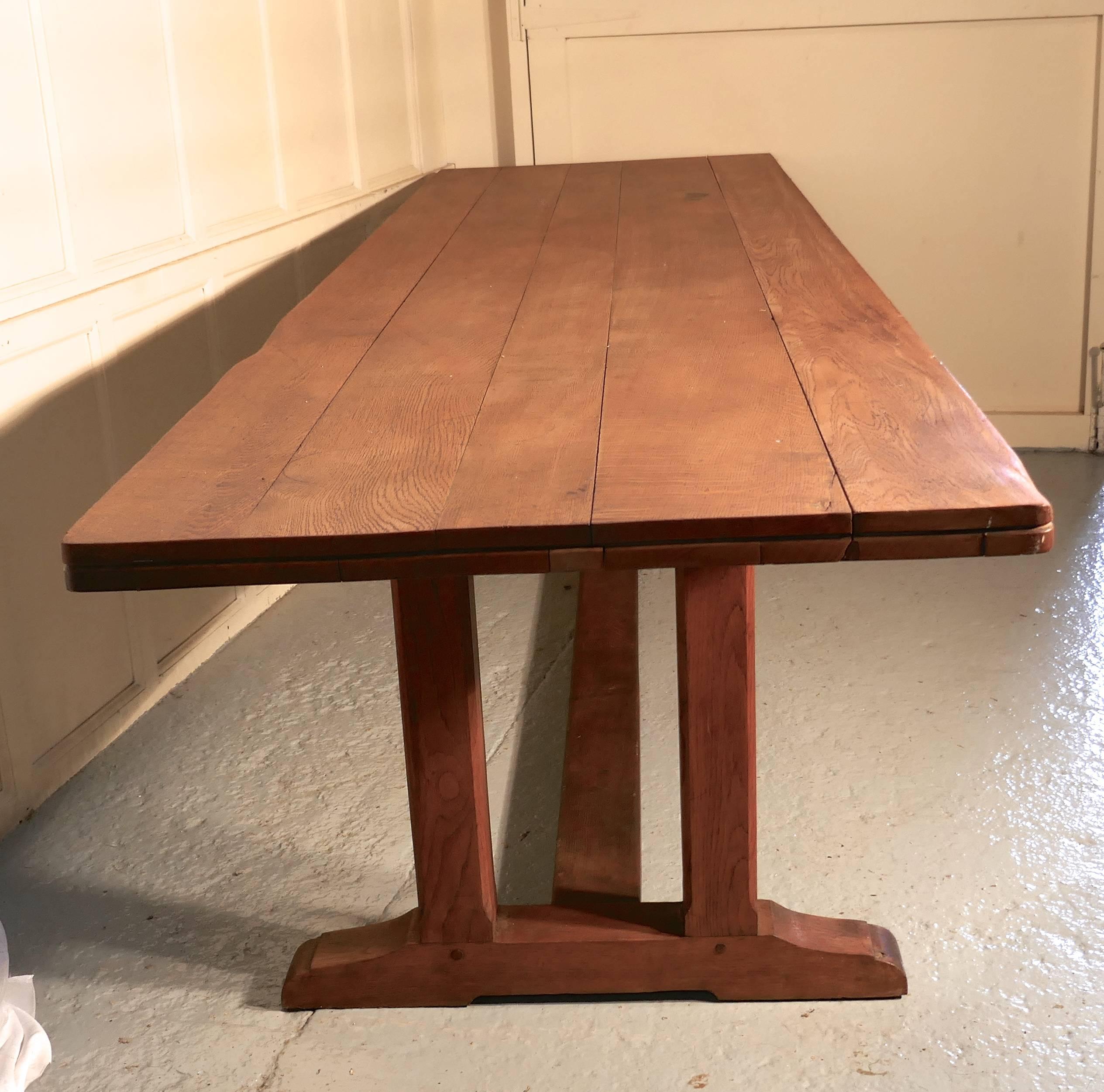 Huge 19th century Arts & Crafts golden oak refectory table

This is a very large table, it has a beautiful five plank oak which is 2” thick
The table legs are in the refectory style with 4” double leg at each end, these are joined with a 5”