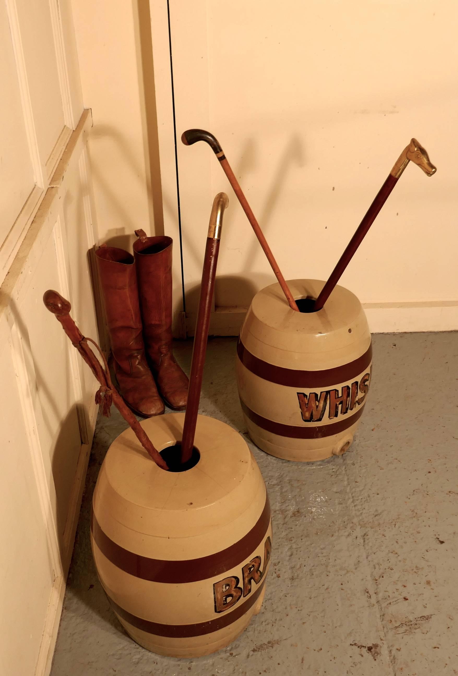 A large pair of 19th century stoneware brandy and whisky barrels, quirky umbrella and stick stands

These large stoneware brandy barrels are in good used condition with traditional hooped design, and Whisky written on one and Brandy on the